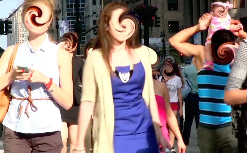 An image by Manuel DeLanda of passerbys on a busy street, with each of their faces swirled and distorted.