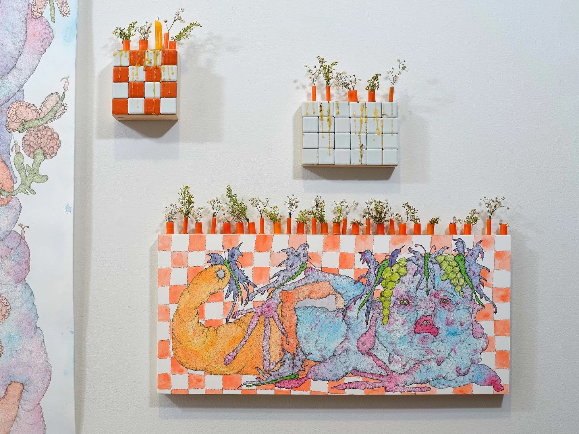 Orange and white checkered block with bulbous figure and greens on top