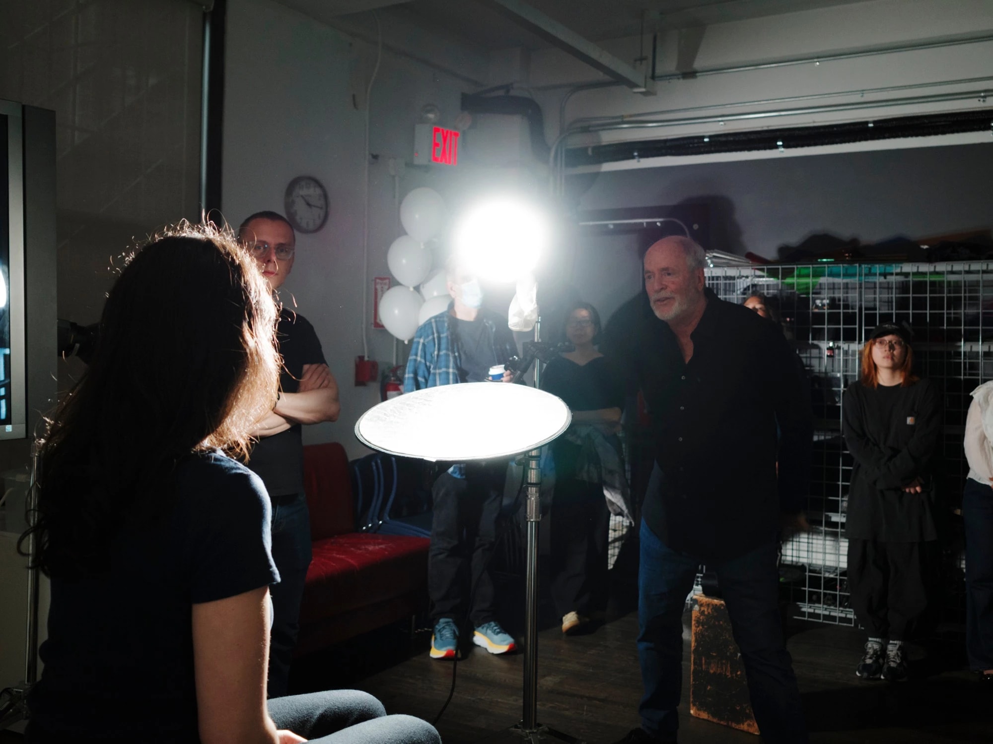 A photo from a lighting workshop with Greg Gorman, where one of our student is modeling for the class to demonstrate lighting techniques.