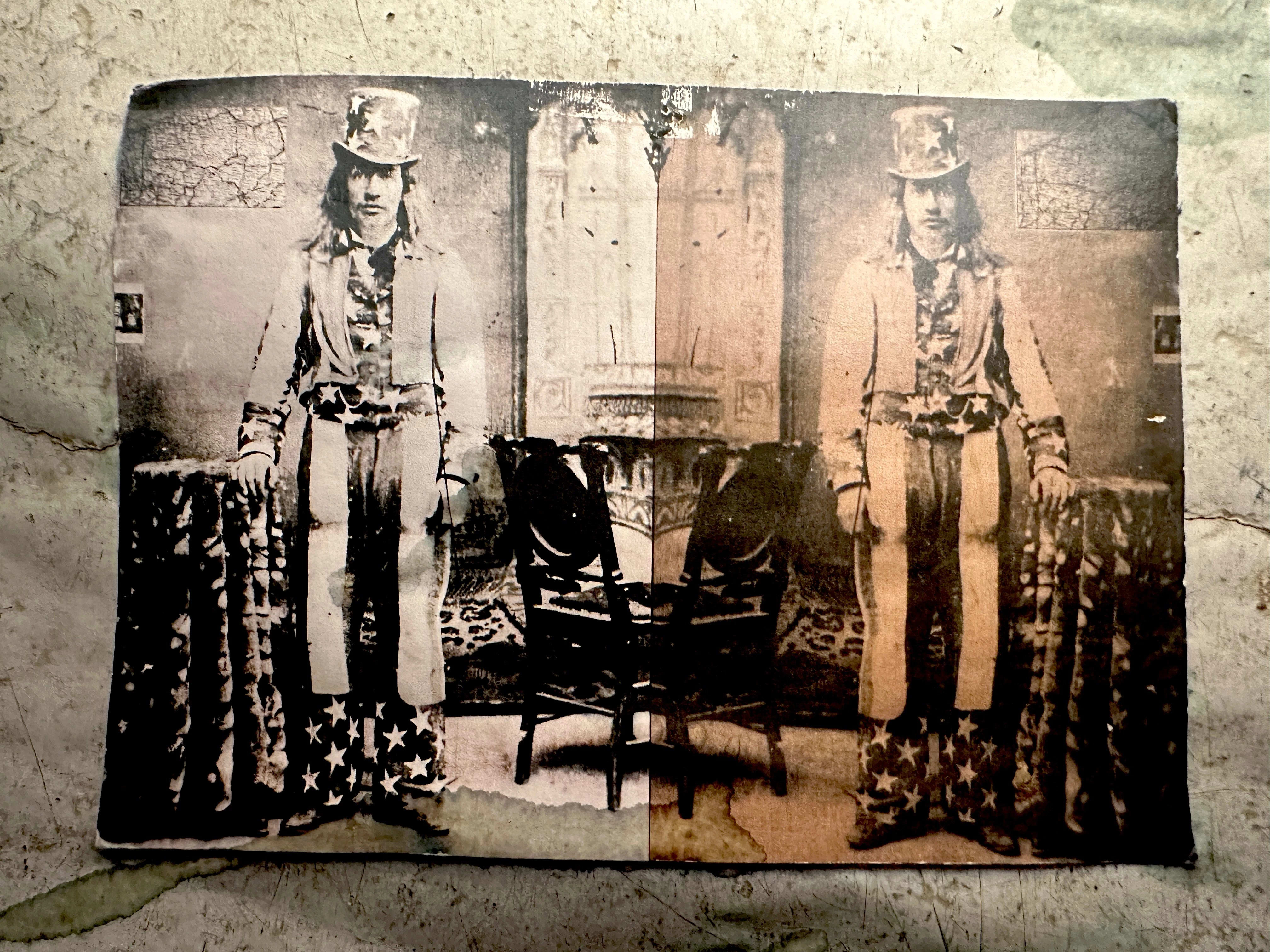 Picture of a mirrored image of a man dressed as uncle sam in black and white and sepia tone.