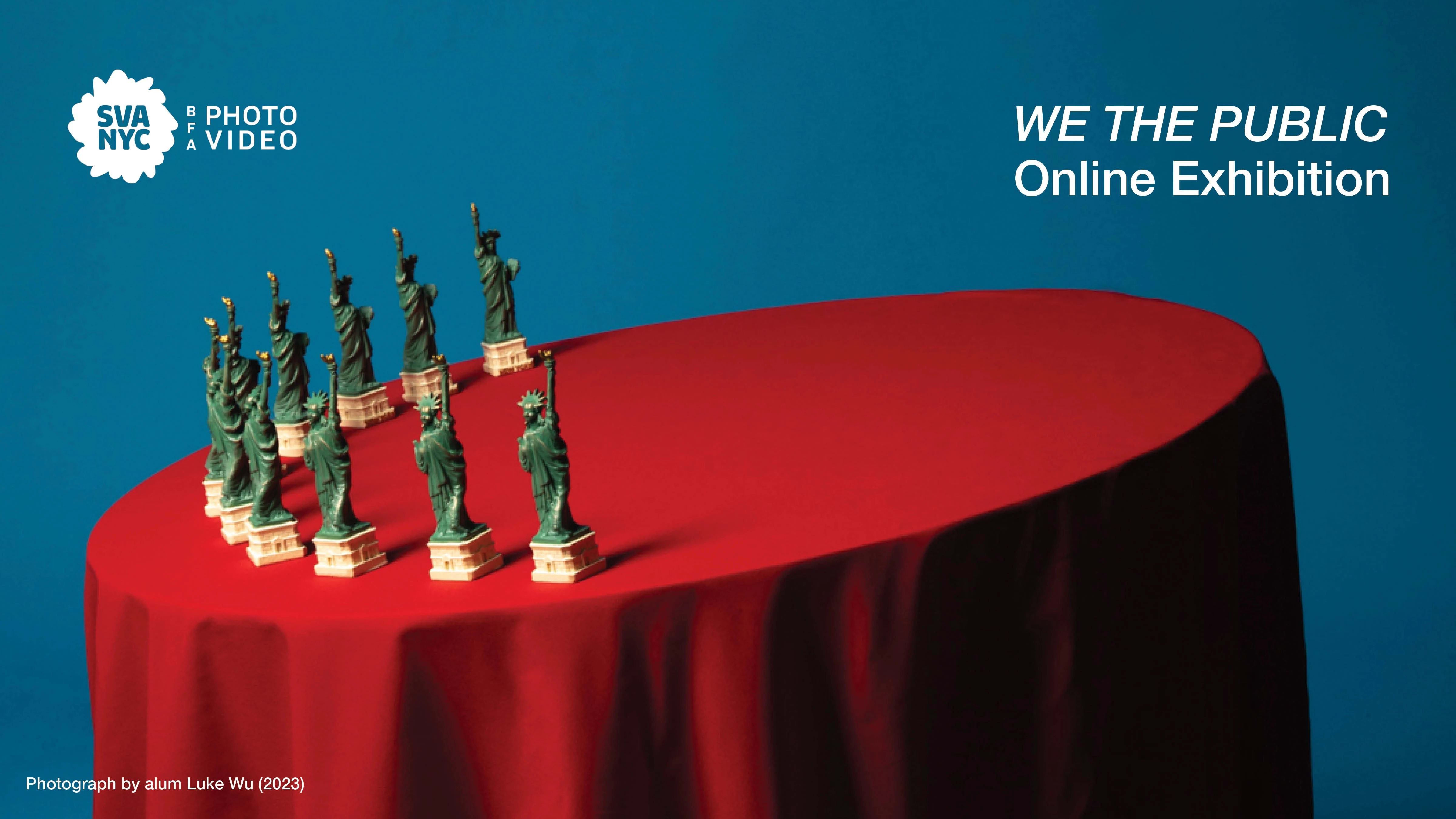 A red table leaning to the left with small statue of liberty replicas on top