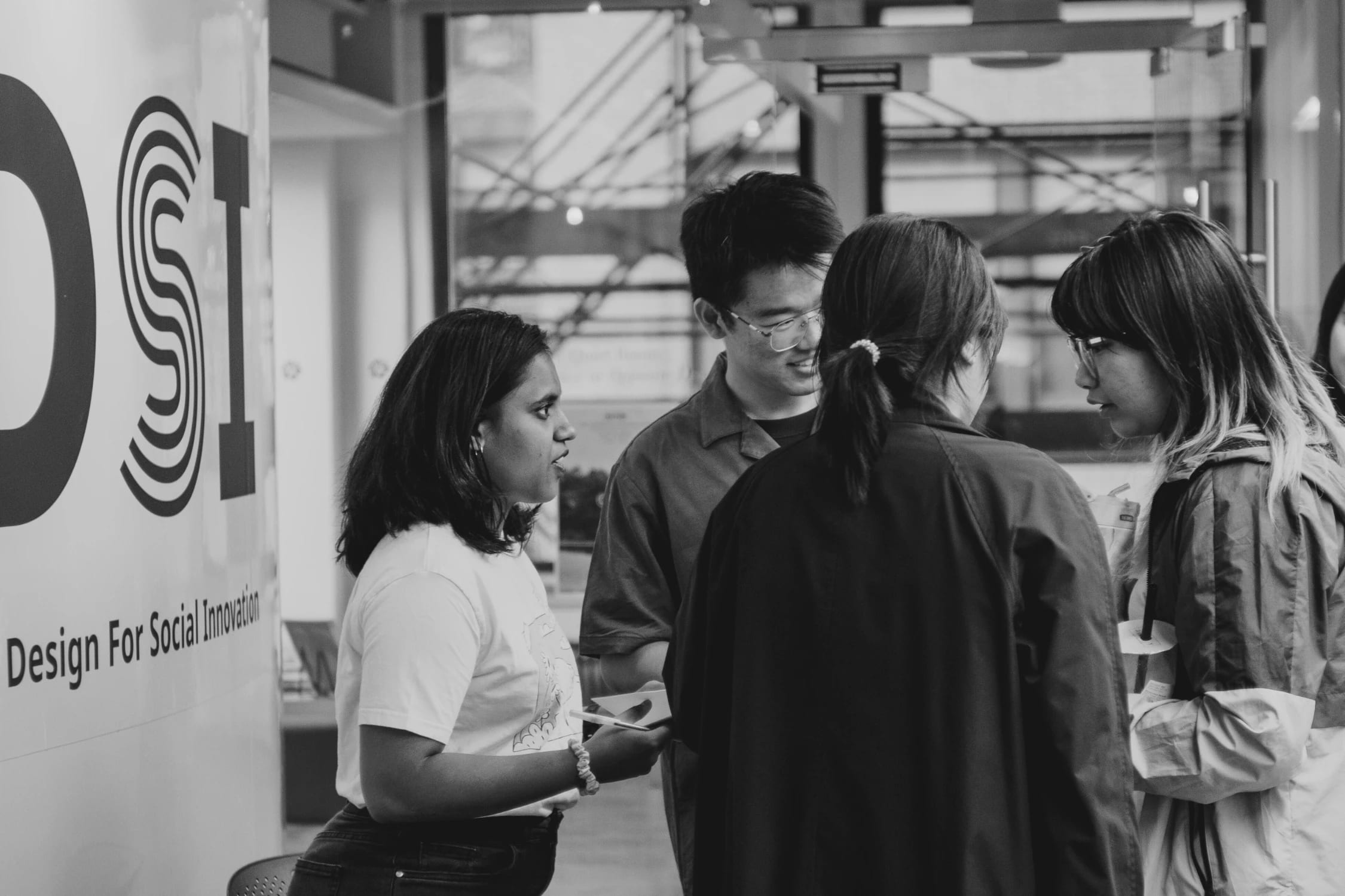 Black and white photo of students collaborating