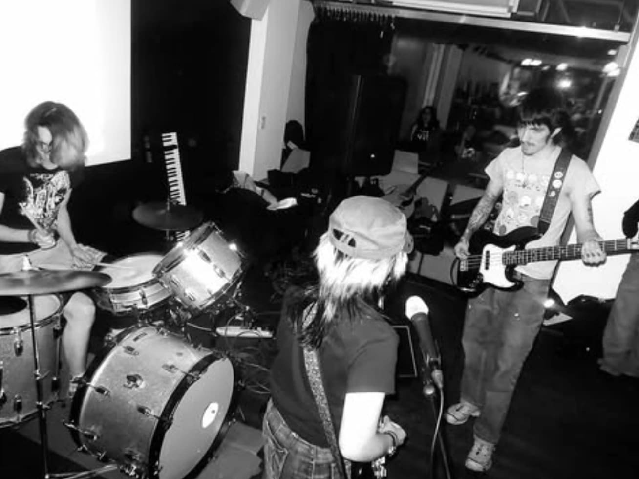 black and white photo of sva students performing in a band at a WSVA radio station event