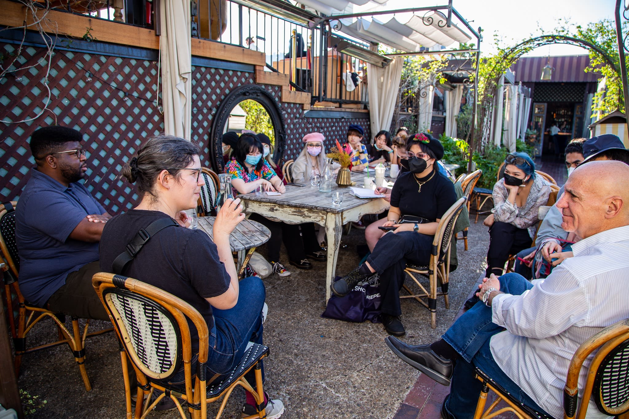 Ian Jones Quartey and Rebecca Sugar sit across from a group of SVA students. 