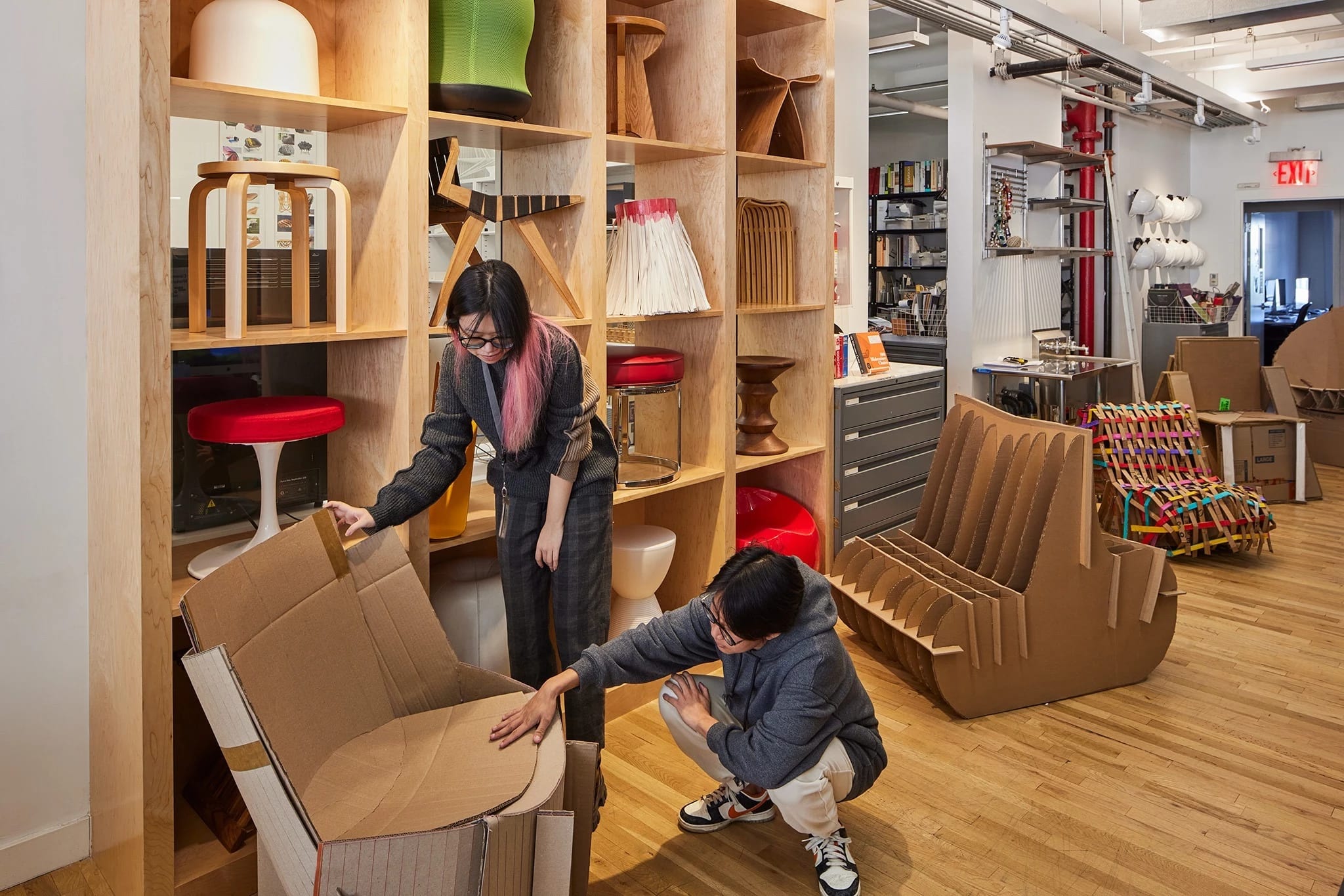 Students examine an item from the chair lab.