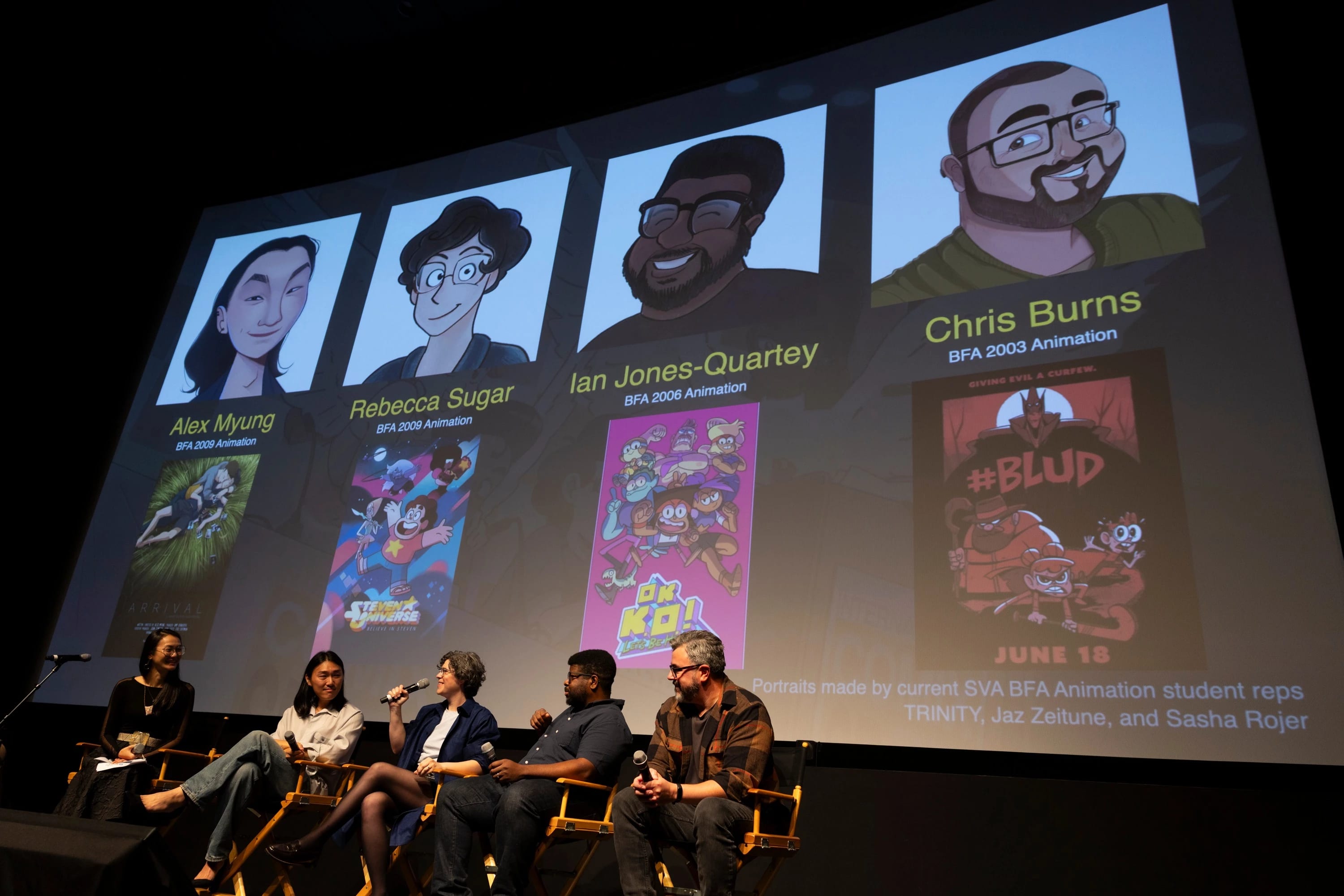 Five individuals sitting on stage with a slide displaying a large slide behind them displaying four animated profile illustrations representing four of the panelists.