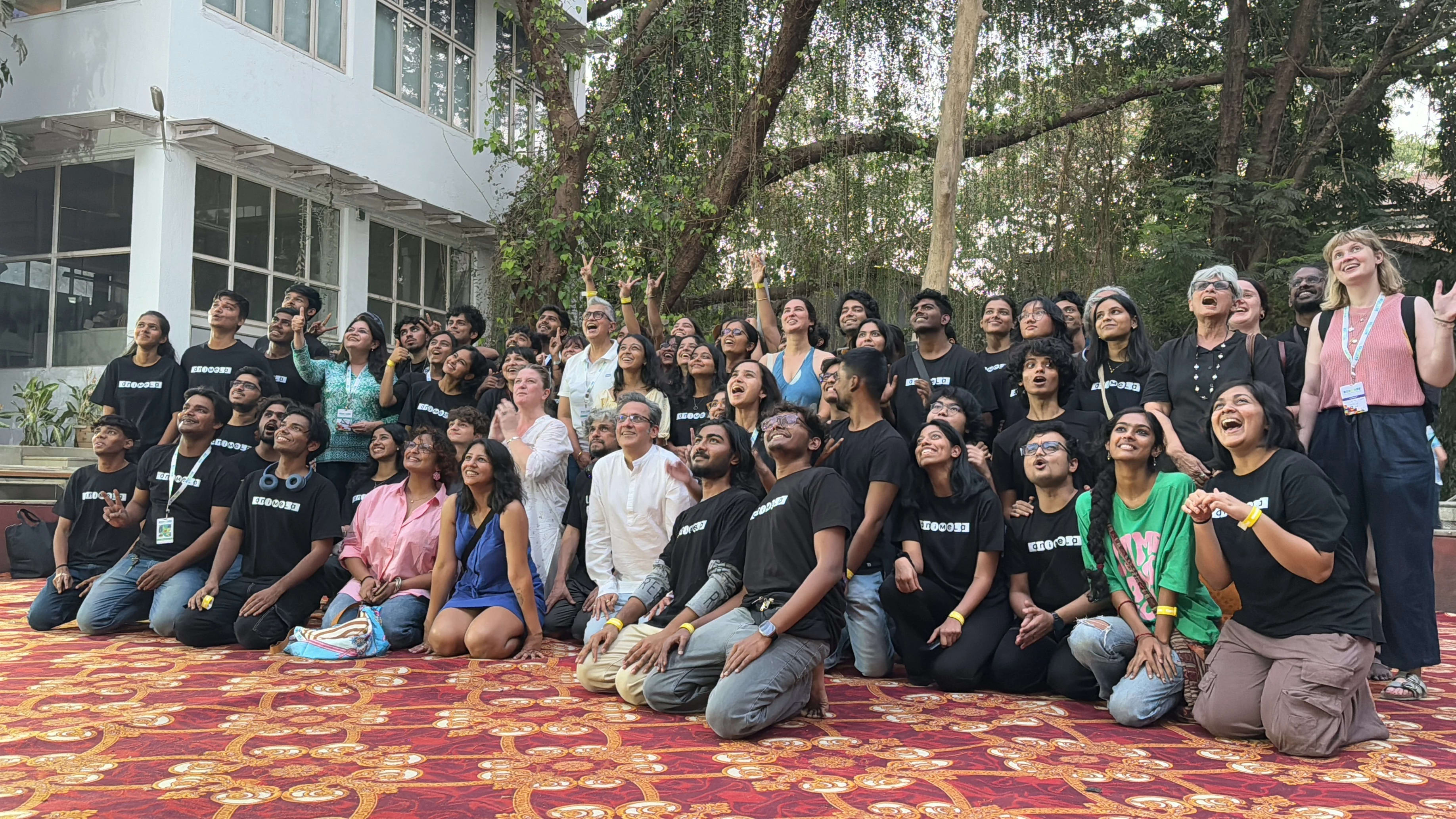 Group photo of students outside a building in India