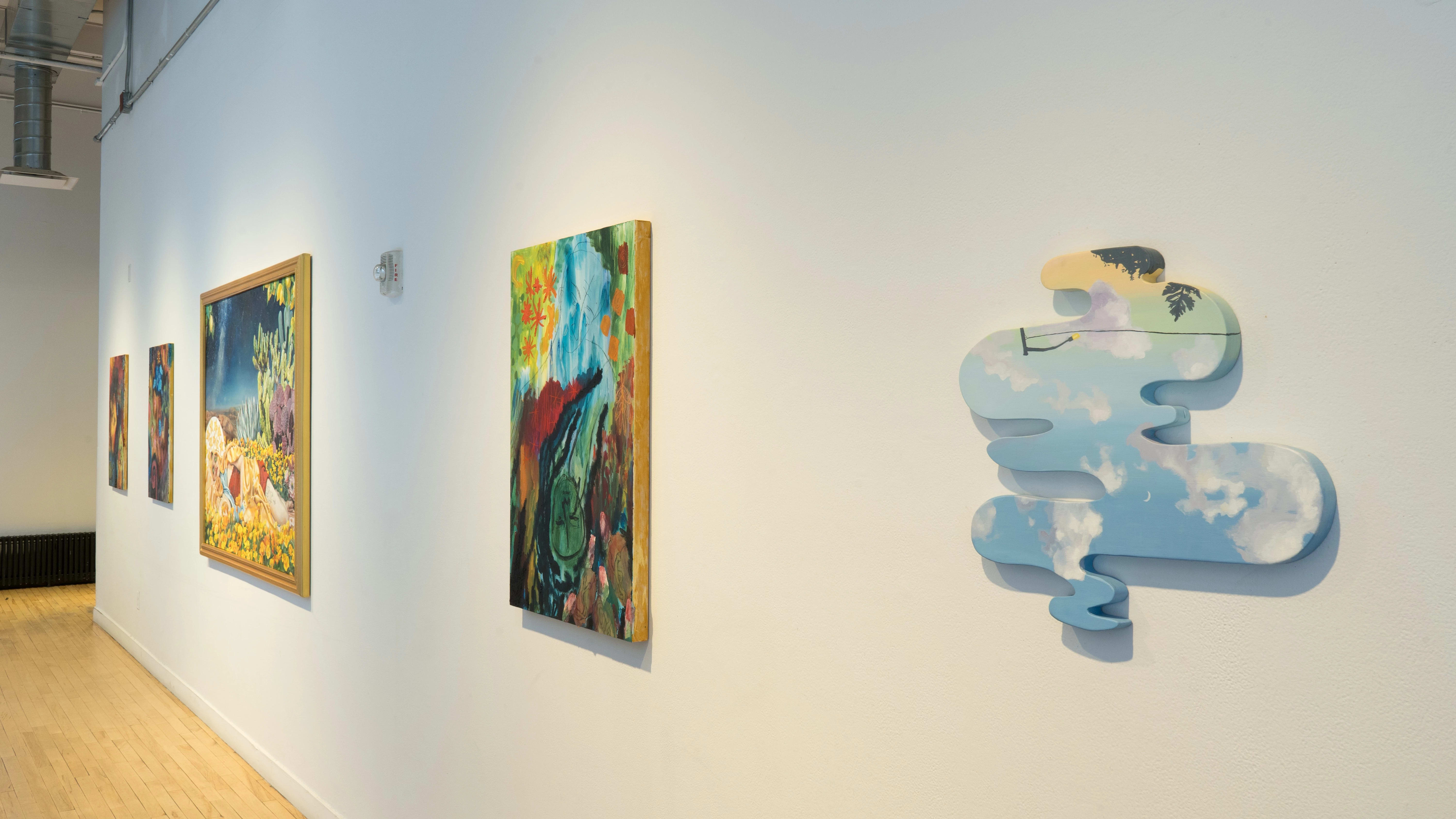 From the opposite end of the SVA Flatiron Windows hallway, the large paintings are visible along with a painting on an organic-shaped panel.