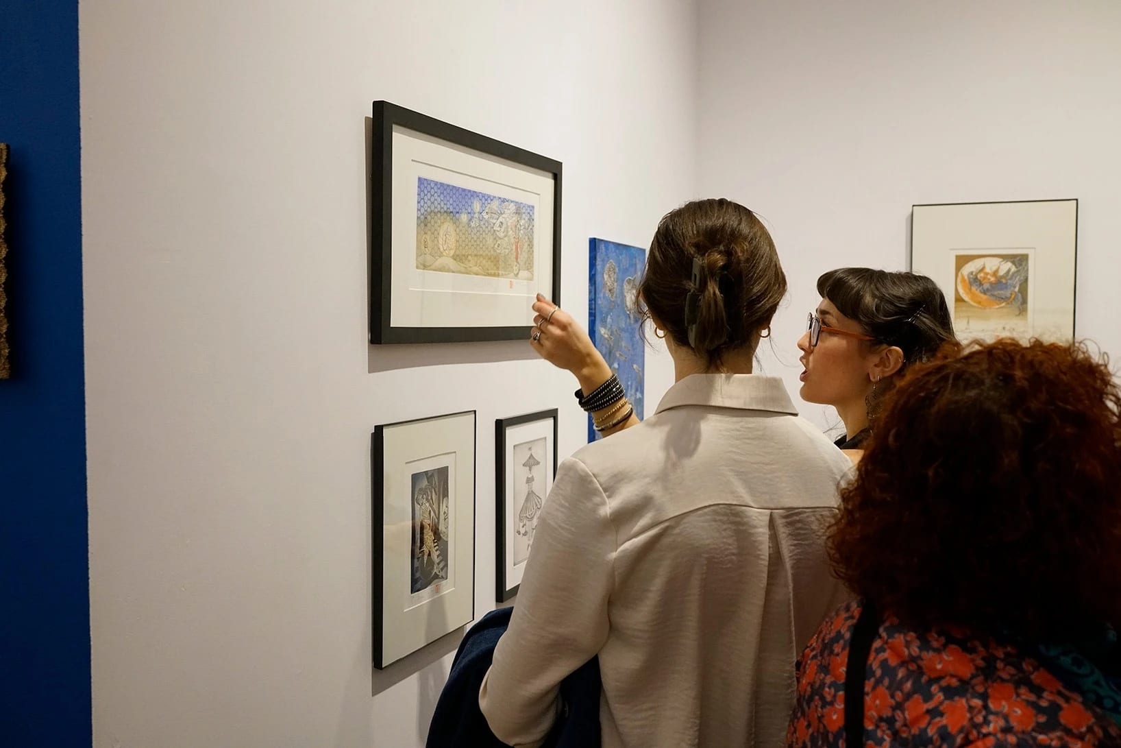 Artist and audience member talking about an artwork in the exhibition.