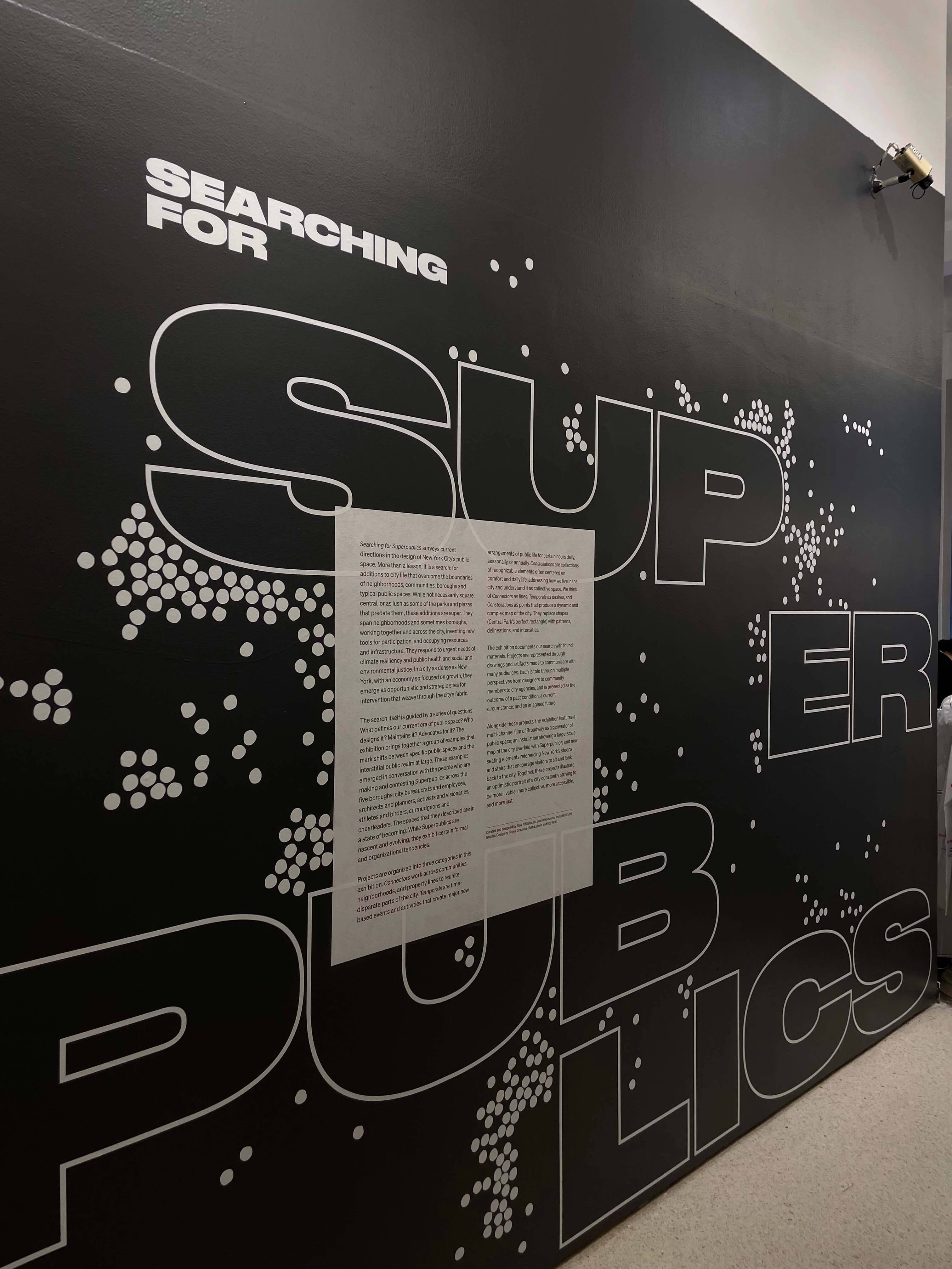 Wall text reading Searching for Superpublics