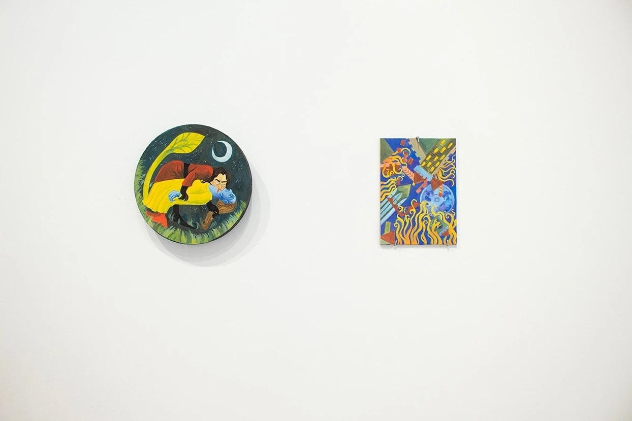 Installation shot of two small paintings.