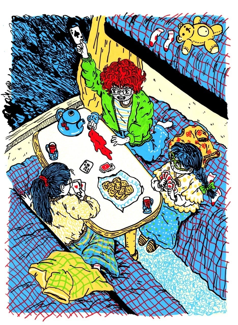 Three girls playing cards on a train in a compartment with a table that has three cups of tea, a teapot, and some cookies.