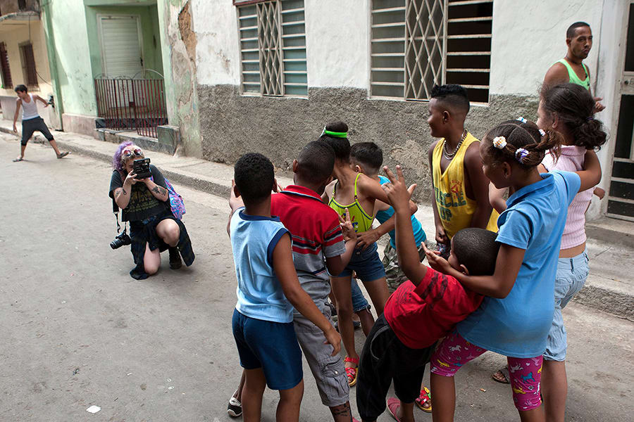 A group of children getting their picture taken.