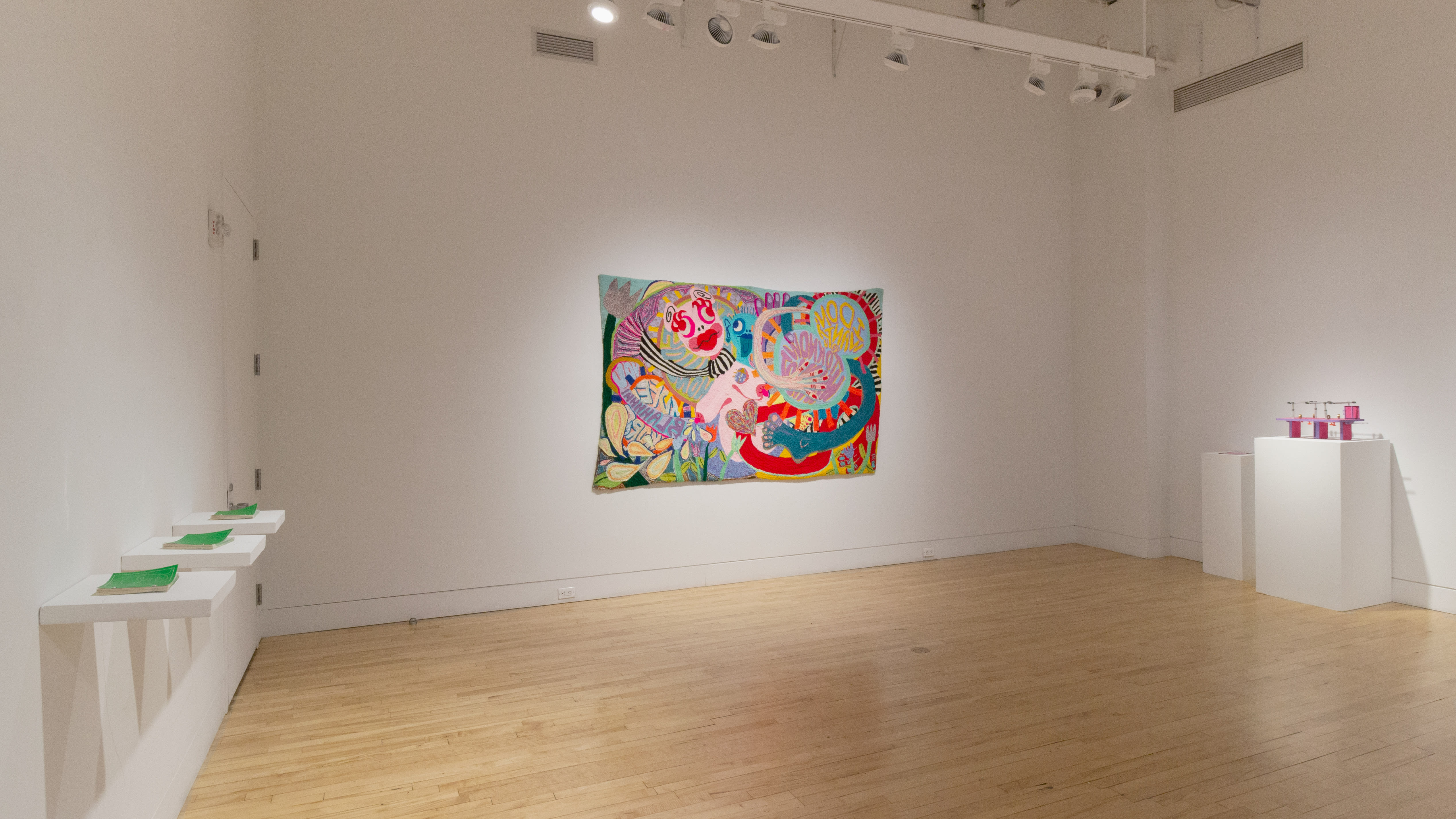 Multiple views of SVA Flatiron Gallery and Windows with sculpture, photography, and fiber art throughout the galleries.