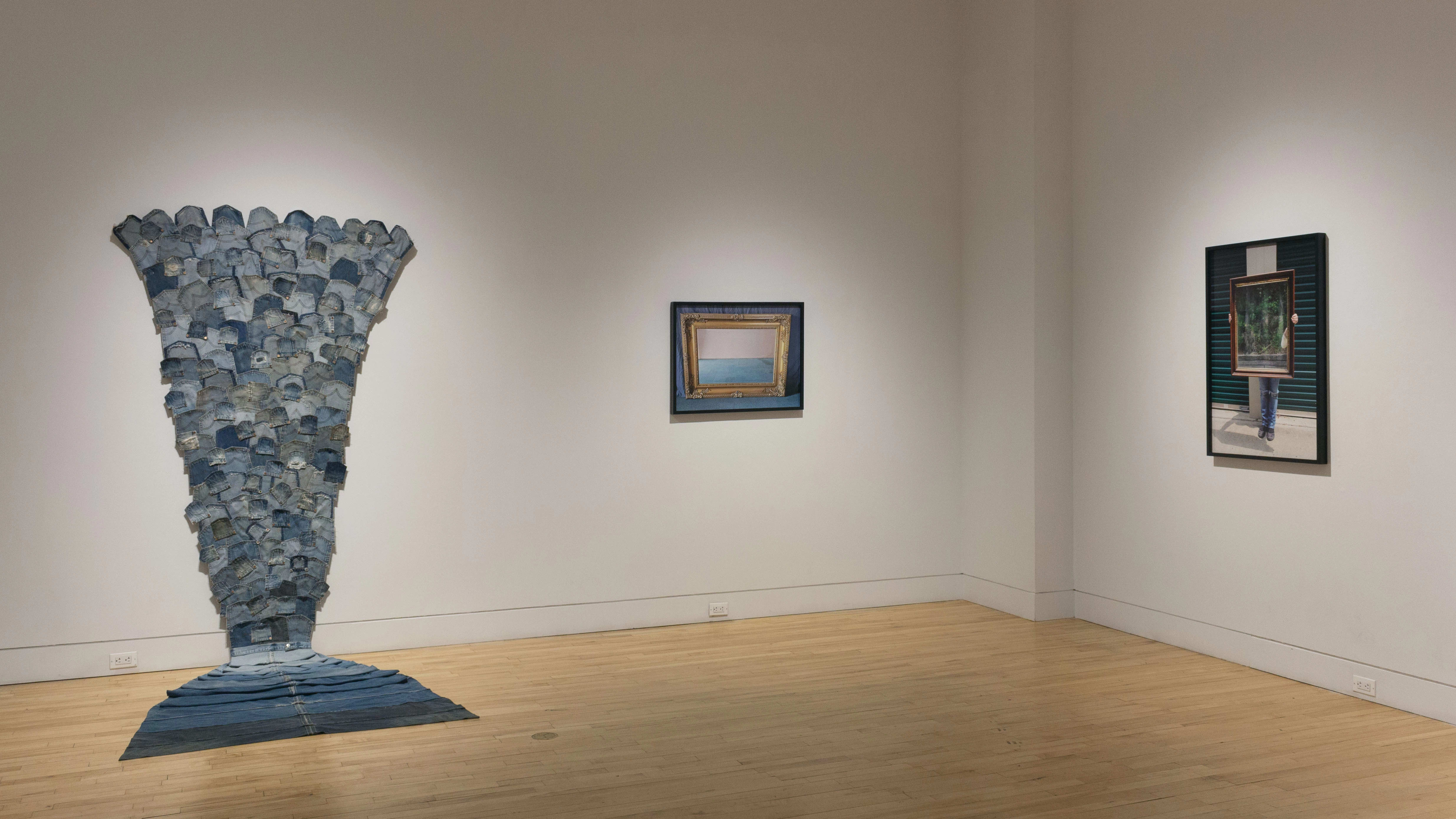 Multiple views of SVA Flatiron Gallery and Windows. There are photographs, collages, and installation work throughout the gallery and displayed in the windows. 