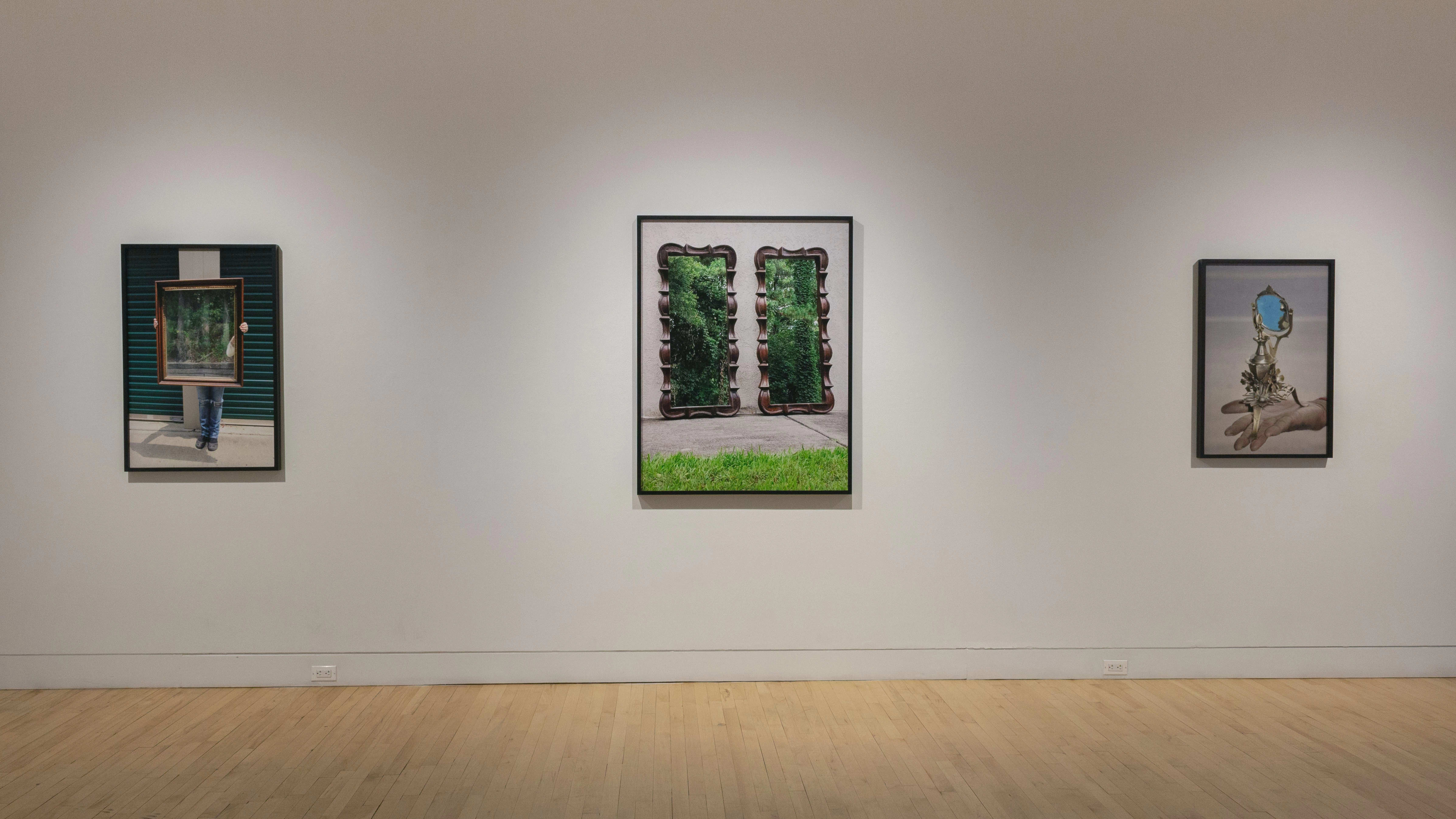 Multiple views of SVA Flatiron Gallery and Windows. There are photographs, collages, and installation work throughout the gallery and displayed in the windows. 