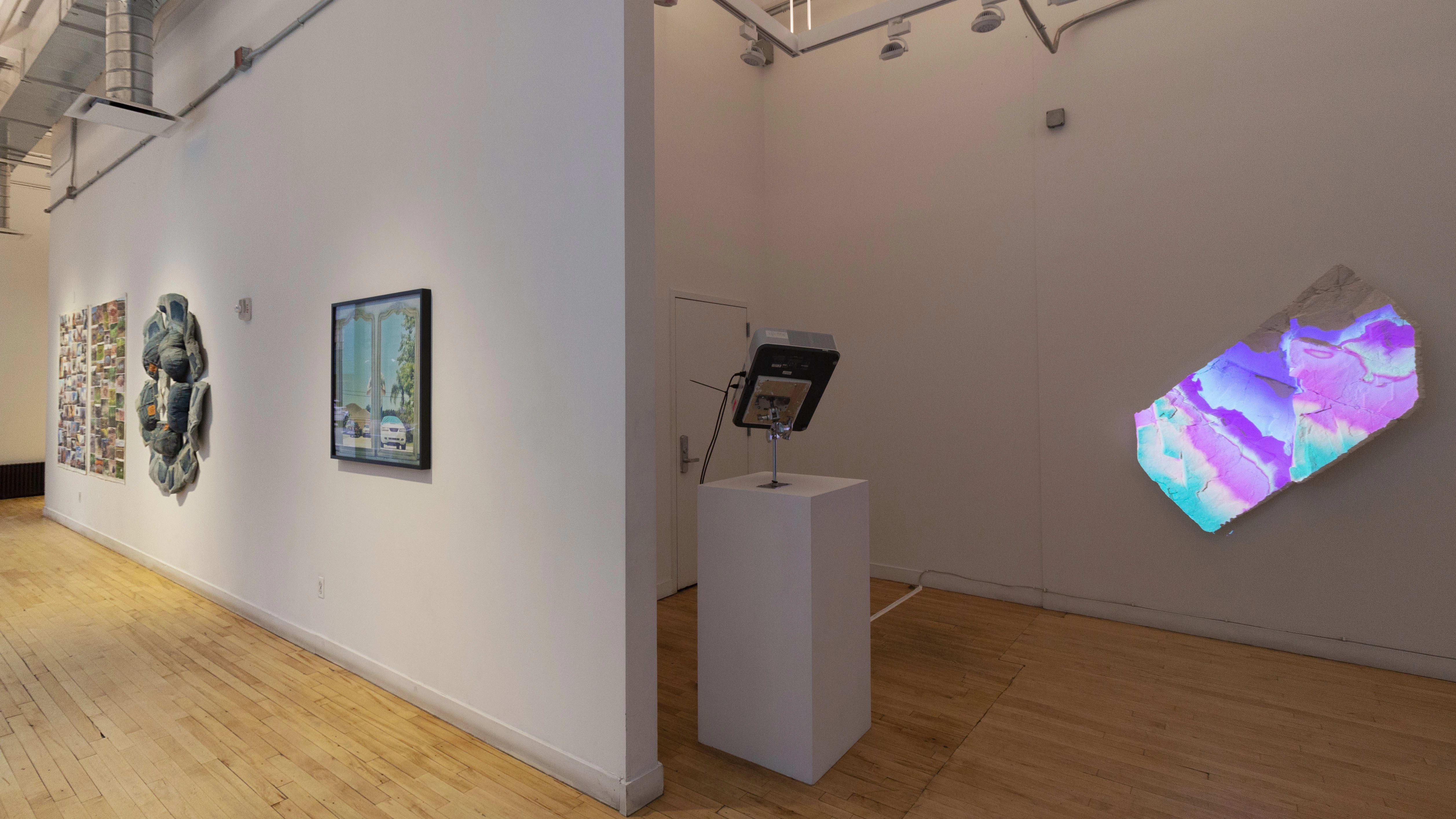 Multiple views of SVA Flatiron Gallery and Windows. There are photographs, collages, and installation work throughout the gallery and displayed in the windows. 
