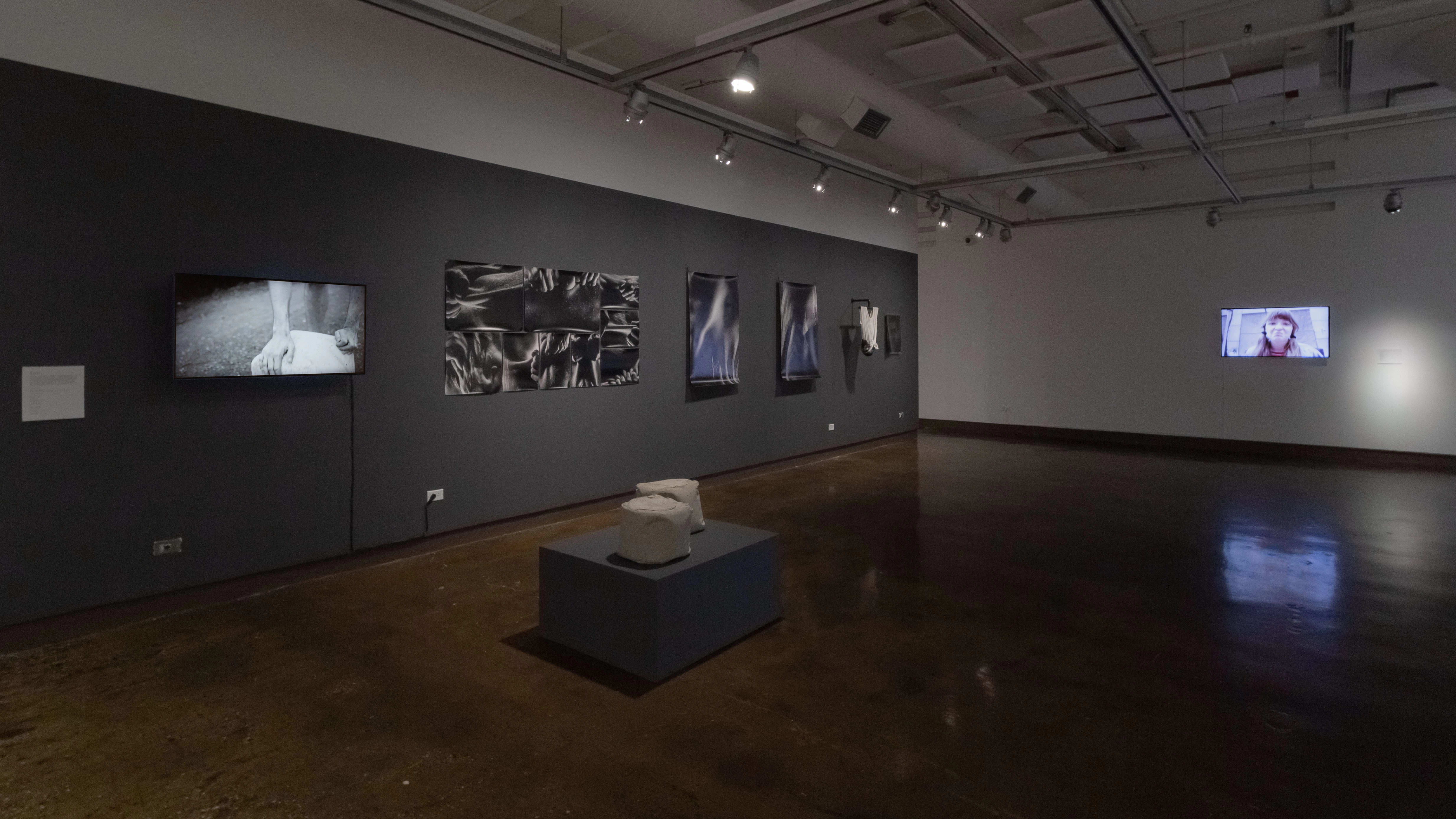 Multiple views of SVA Chelsea Gallery with framed and unframed photographs, video, and installation with projectors. 