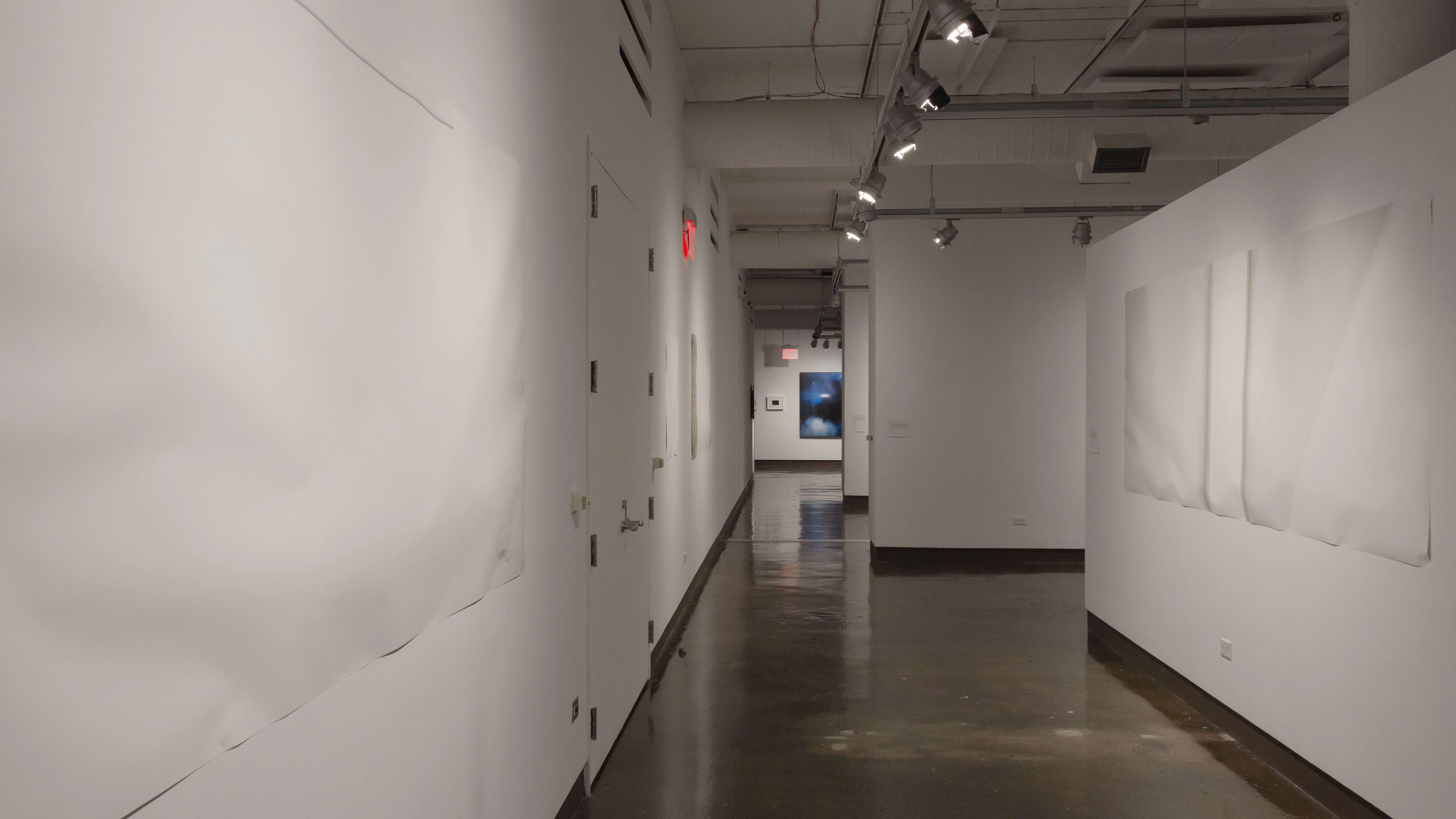 Multiple views of SVA Chelsea Gallery with framed and unframed photographs, video, and installation with projectors. 