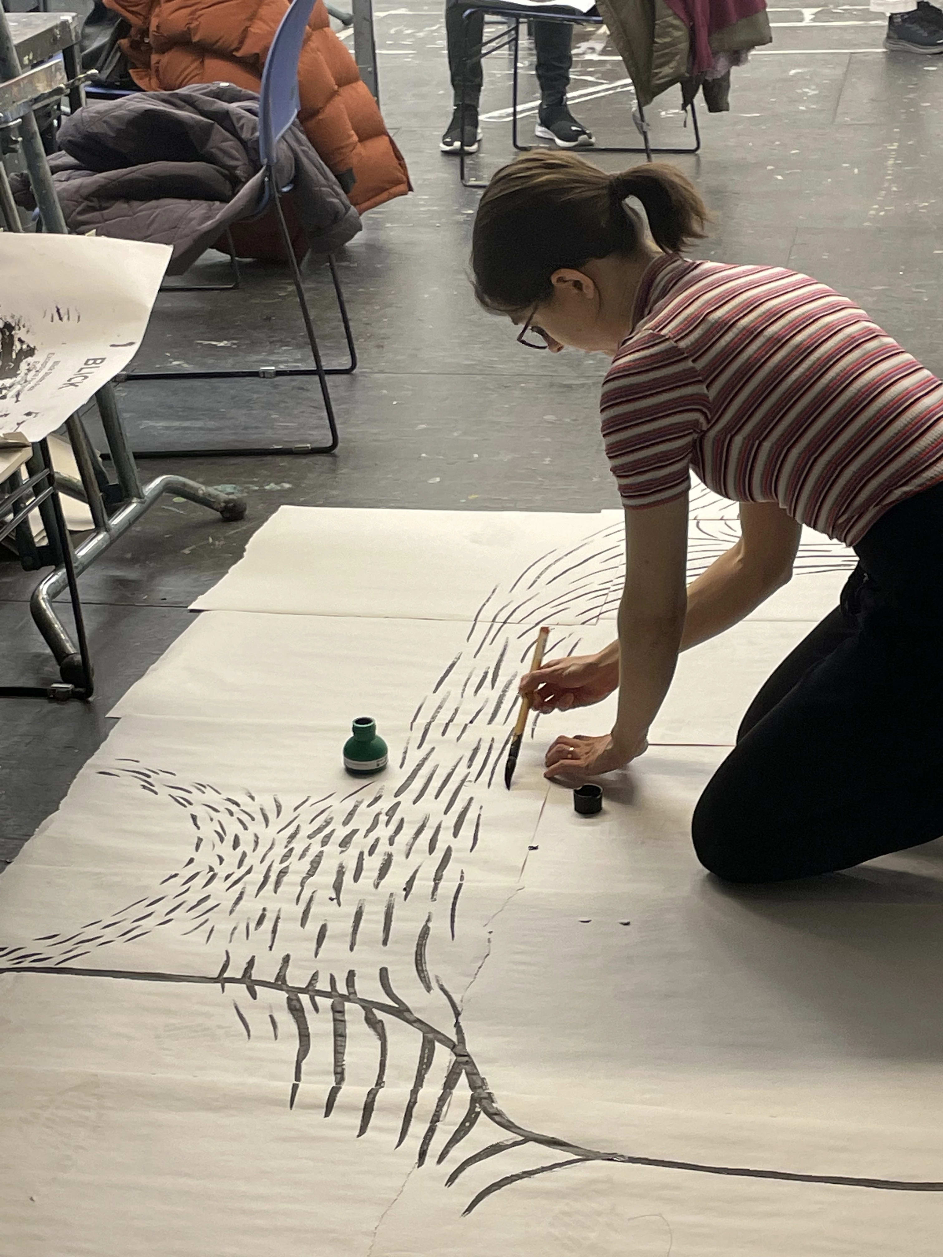 Students working in the classroom in the course Drawing as Social Practice.
