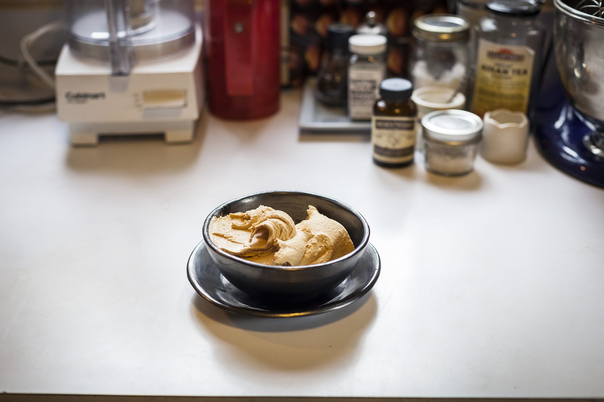 A bowl of gelato on a kitchen countertop.