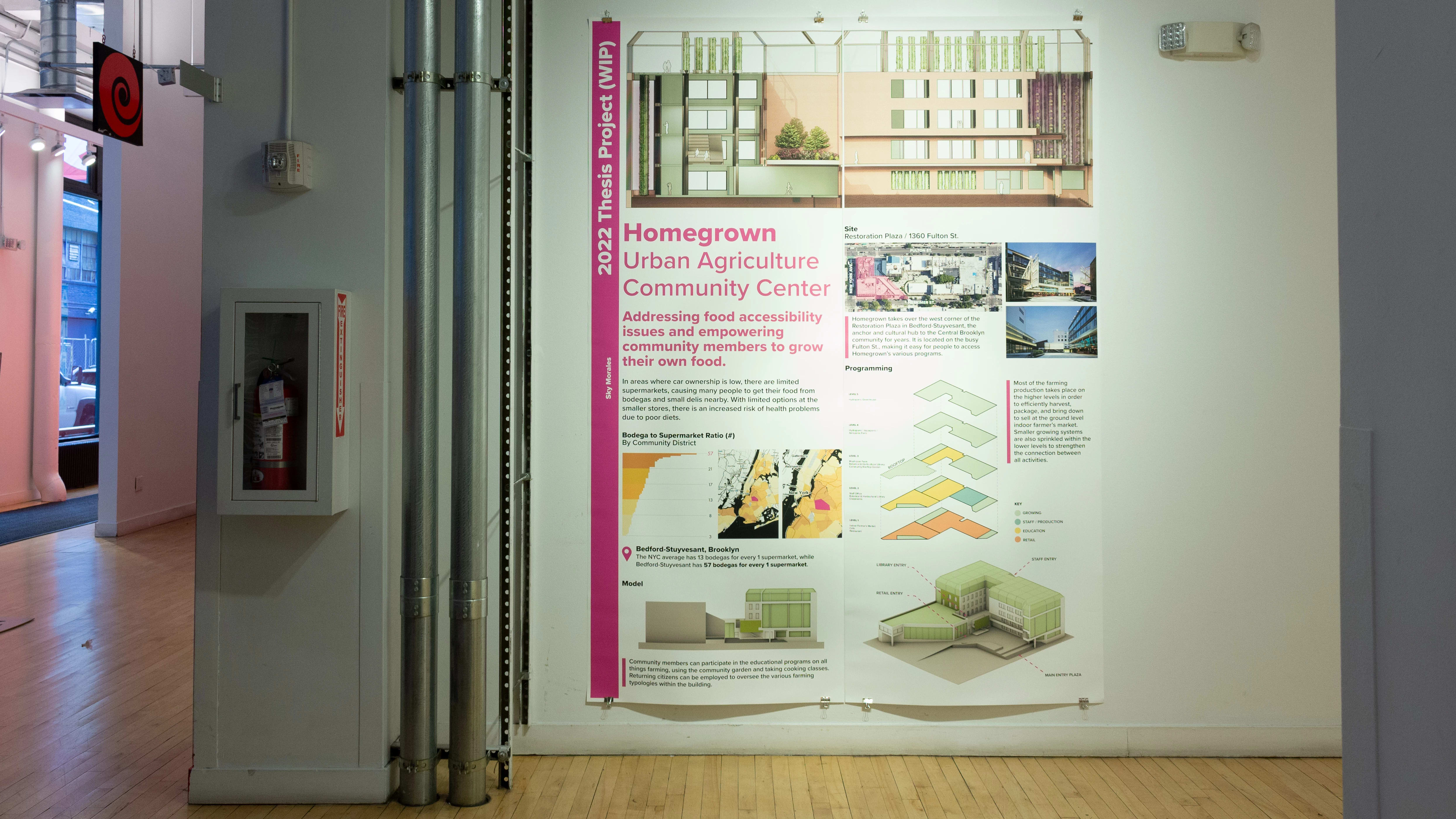 Exhibition view of An Infrastructure for Restorative Justice, featuring hallway with a large poster on the wall.