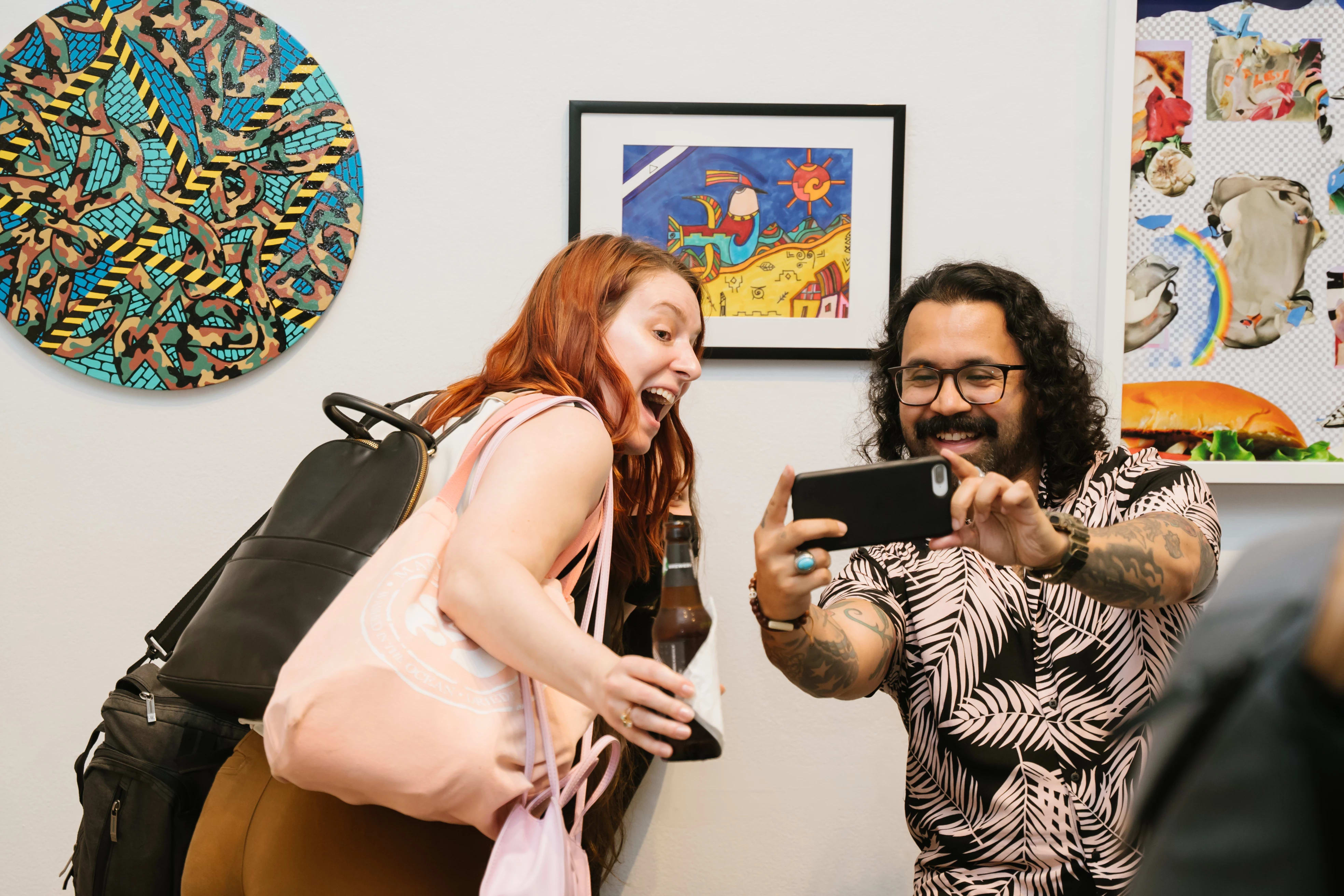 Reception photo showing two people taking a selfie.