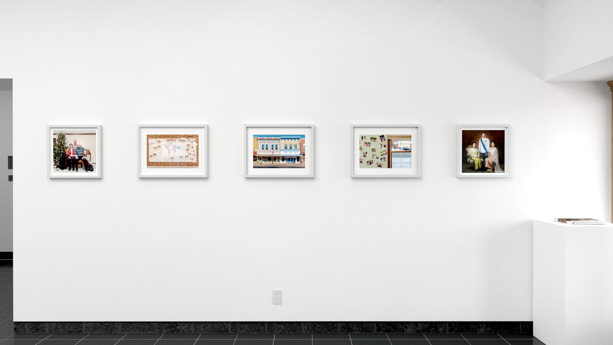 Five color photographs in horizontal row, each in a white frame, with a small book on pedestal to their far right.