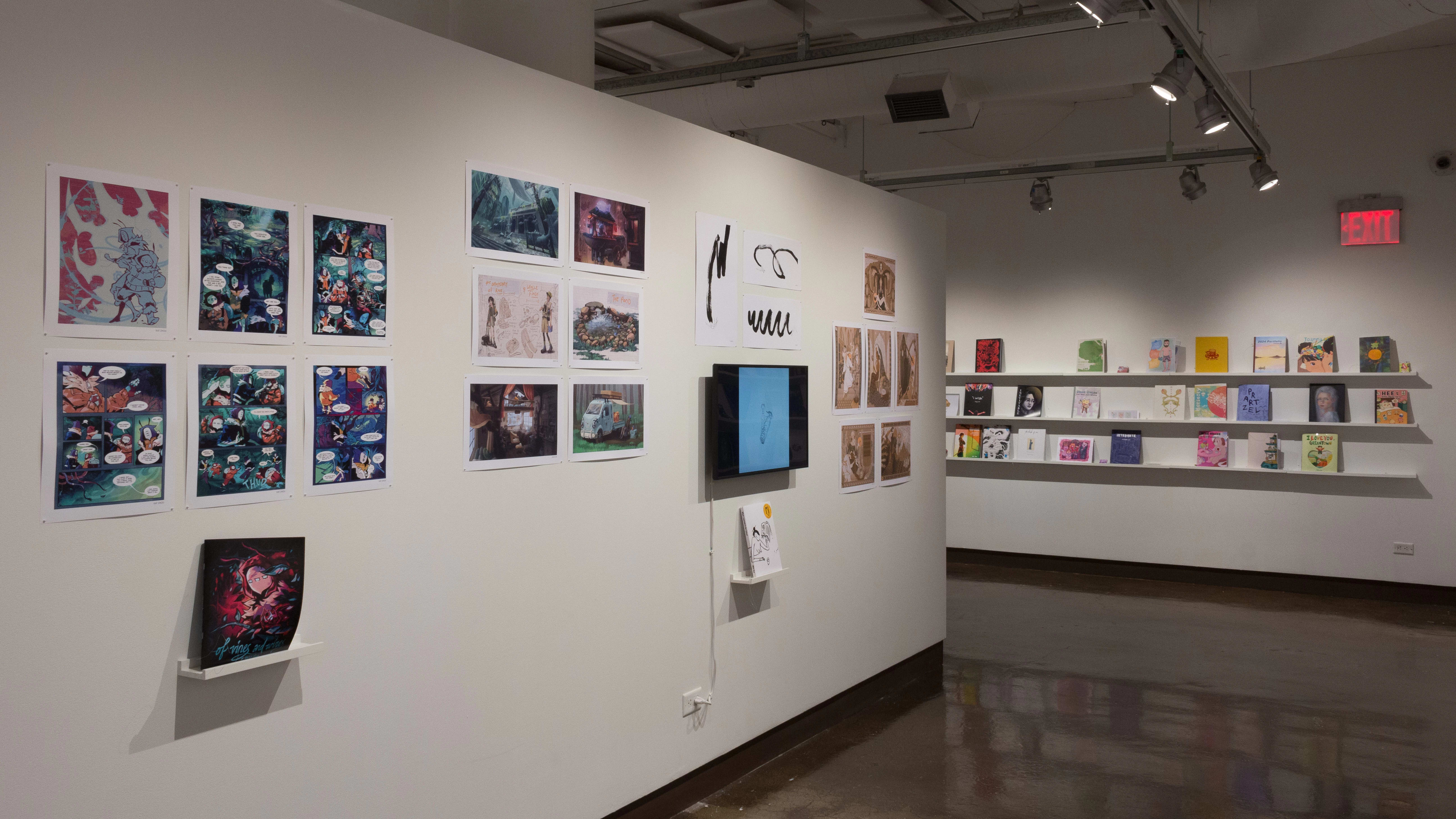 The prints hanging on the walls vary in dimension, style, and color. Books sit on shelves beneath the prints and a TV displays online works and animations.