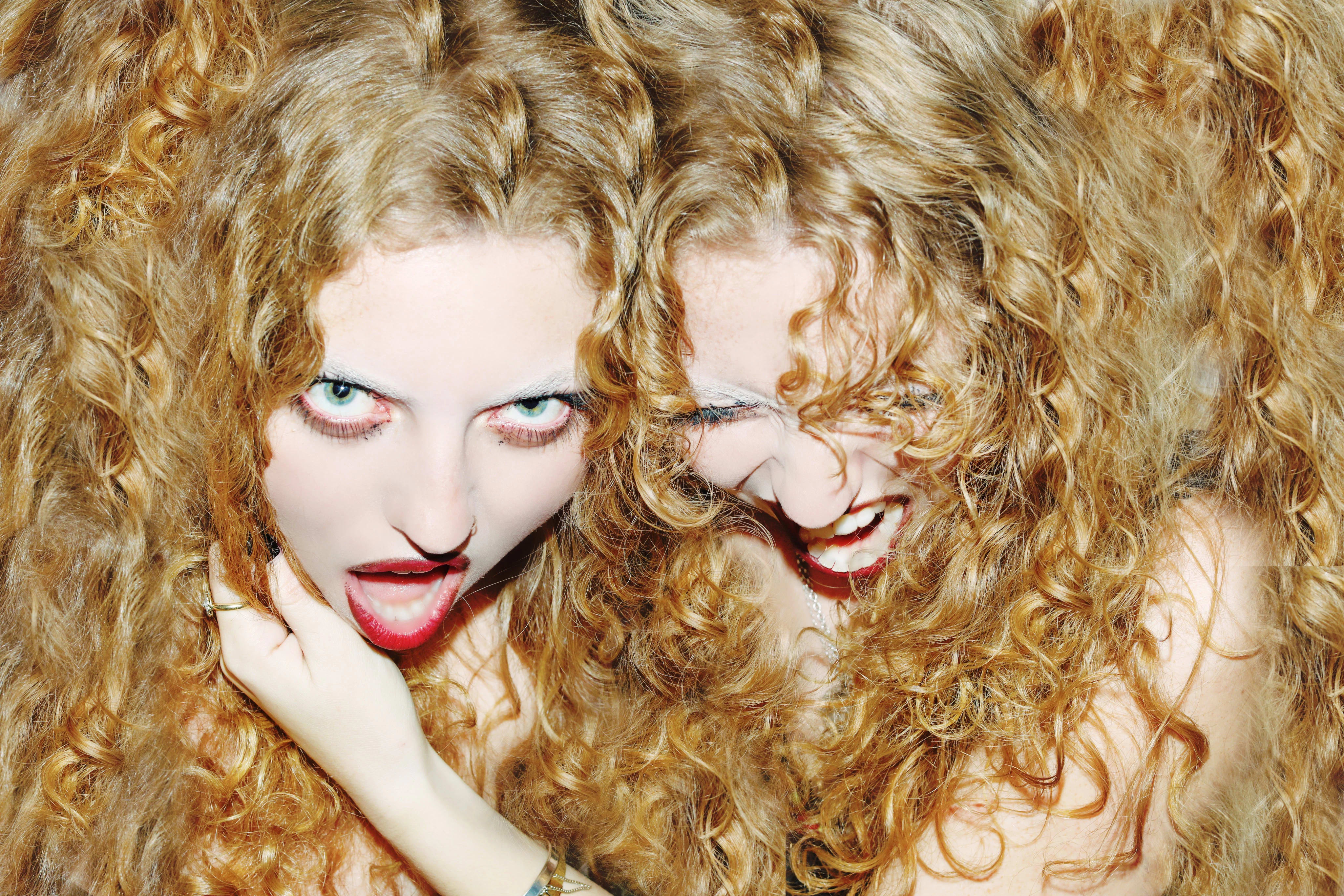 This is an image of my friends who are twins. They have beautiful curly hair and I wanted the image to blend the hair so that it looks like the hair belongs to both girls and that they are attached.