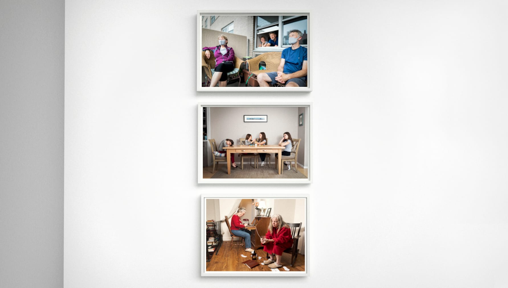 Three color photographs in vertical line in white frames.