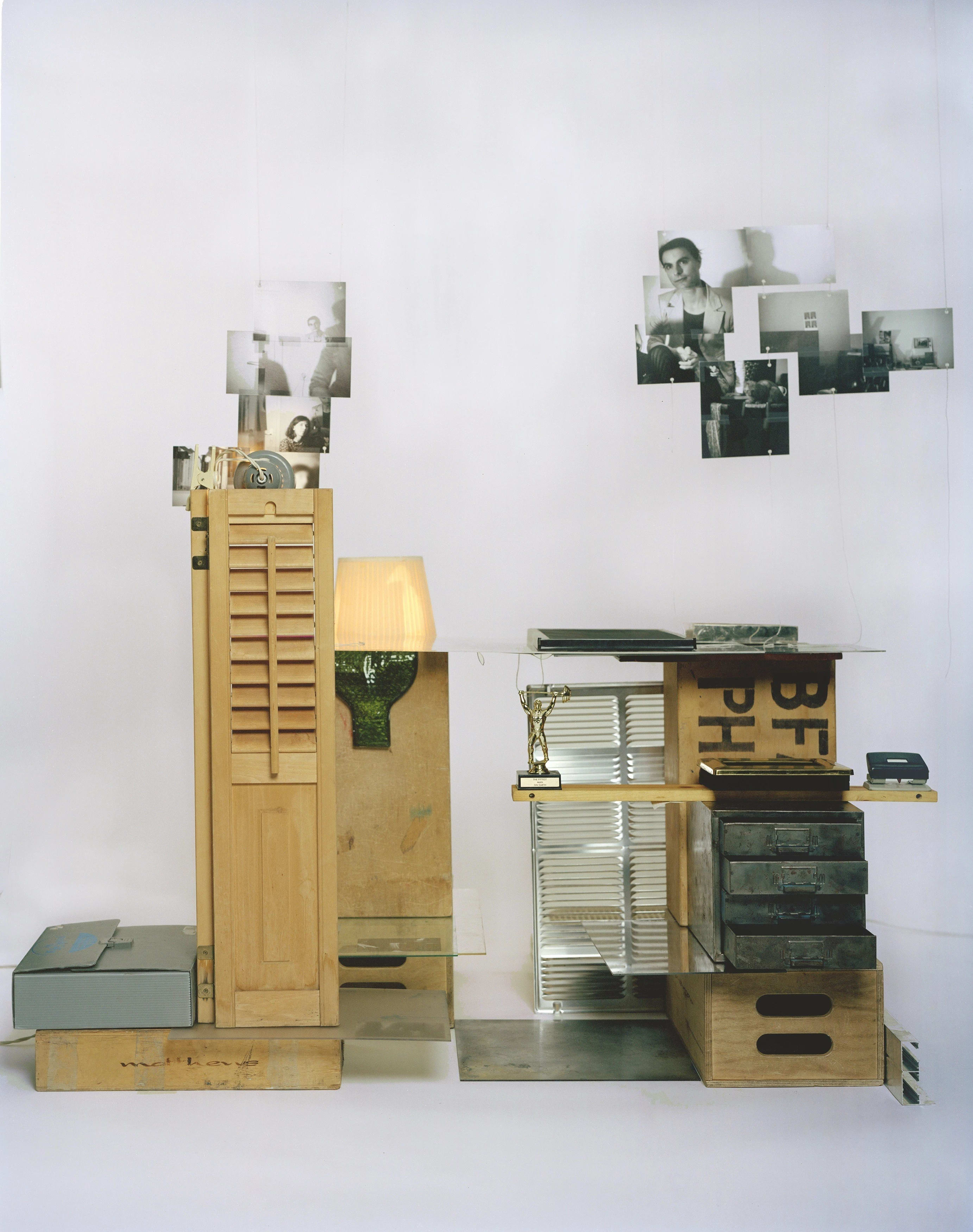 art installation including photos, drawers, wooden apple boxes