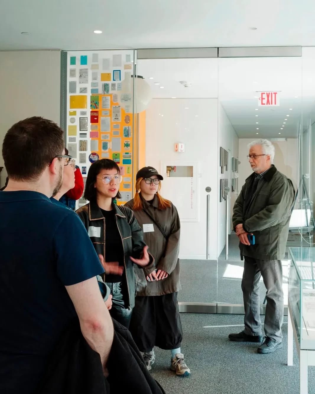 A photo from a class visit to the New York Times headquarter in New York City, where the Masters in Digital Photography students are inquiring about the history of the famed newsroom.