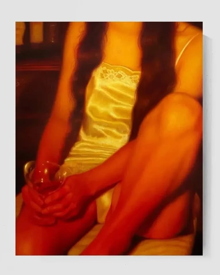 A warm lit painting of a woman in a night gown holding a glass.