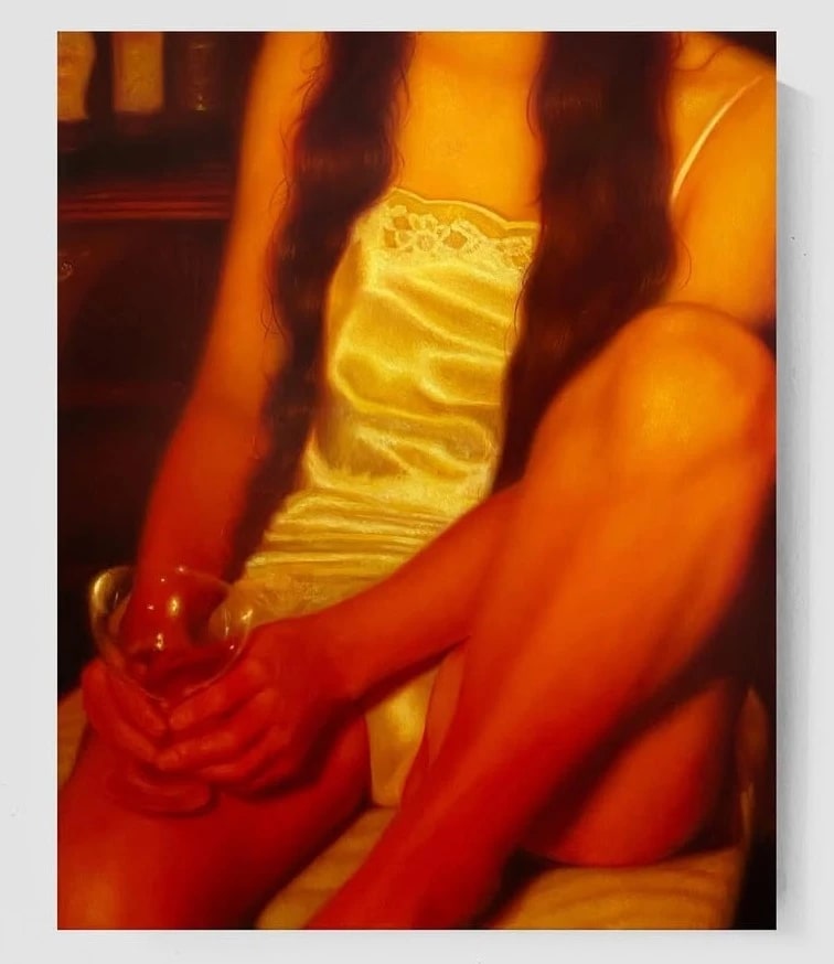 A warm lit painting of a woman in a night gown holding a glass.