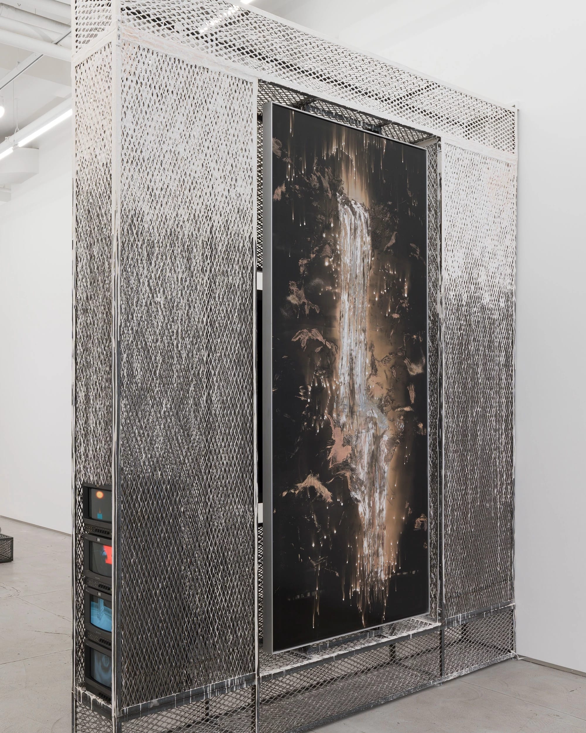 Nocturne III (2025, installation view) Unique chemical painting on light-sensitive silver gelatin paper, steel, hydrocal, CRT monitors, video 10 x 10 x 1 foot