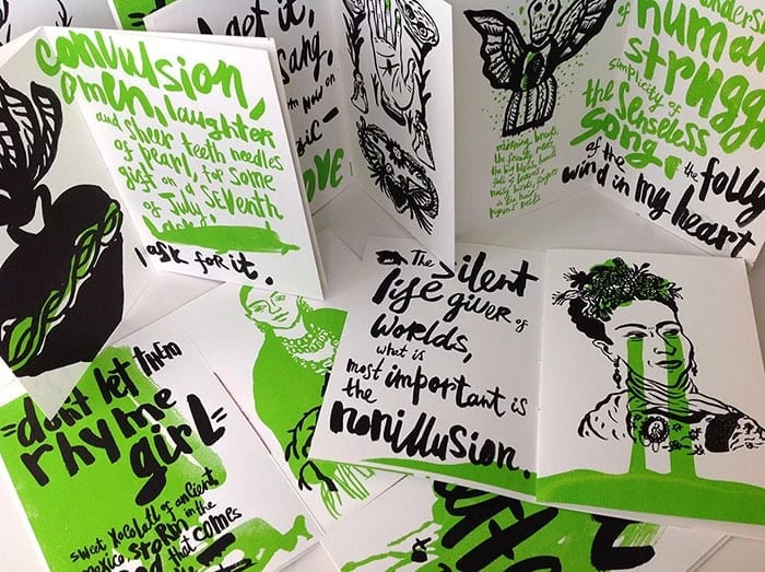 A photograph of several copies of a zine-like illustrated book.