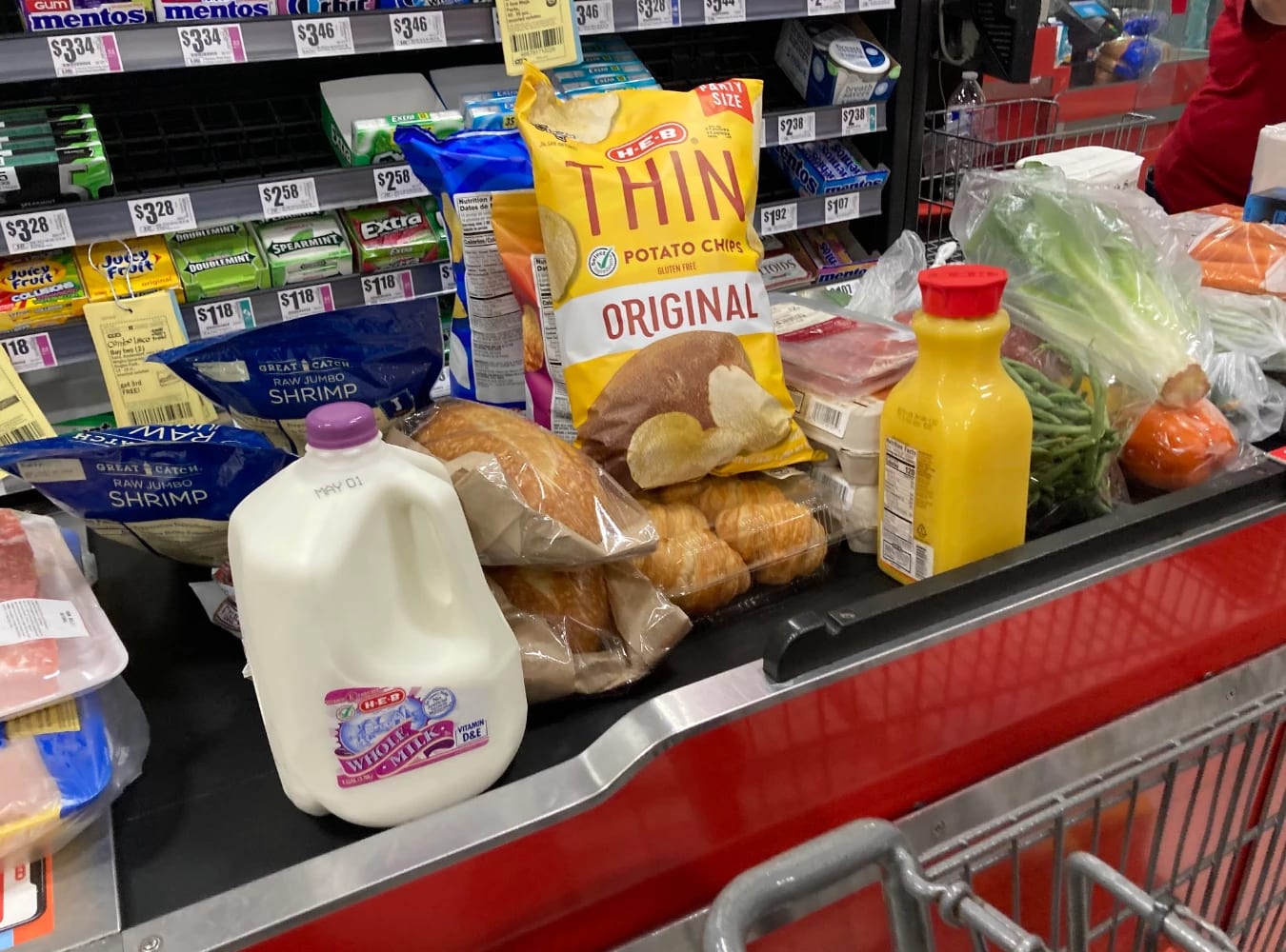 Conveyor belt at grocery store with groceries on it