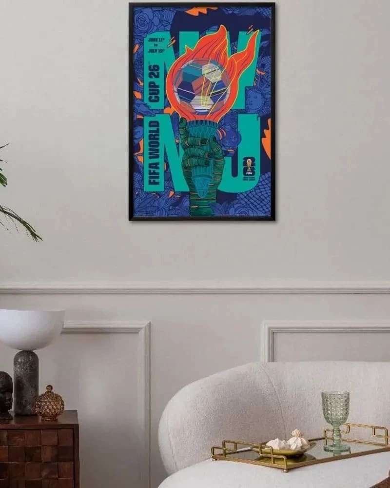 Rich Tu's FIFA 2026 New York New Jersey poster hung up in a frame on the wall of a room.