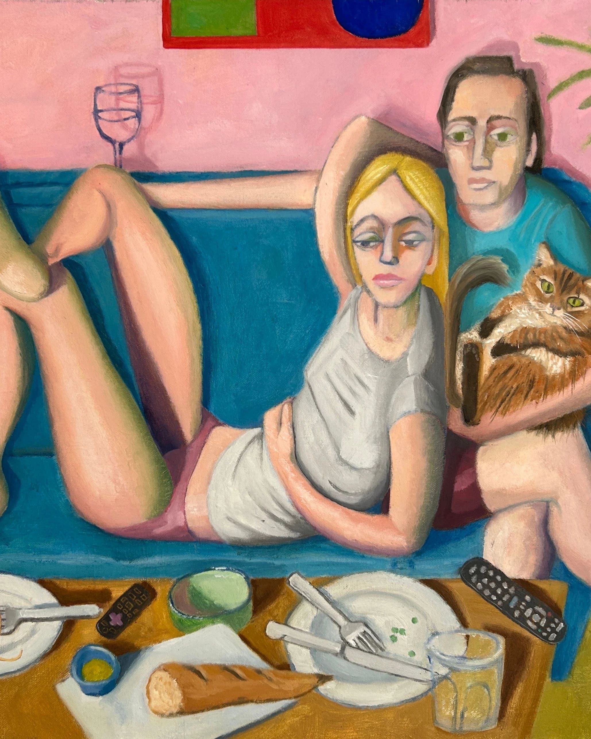 A painting of a domestic scene, featuring a male and a female figure with their cat, seemingly watching an out of view television, while resting on a blue couch. Used dinner plates rest on a coffee table before the figures, and a banana is taped to the pink wall behind them.