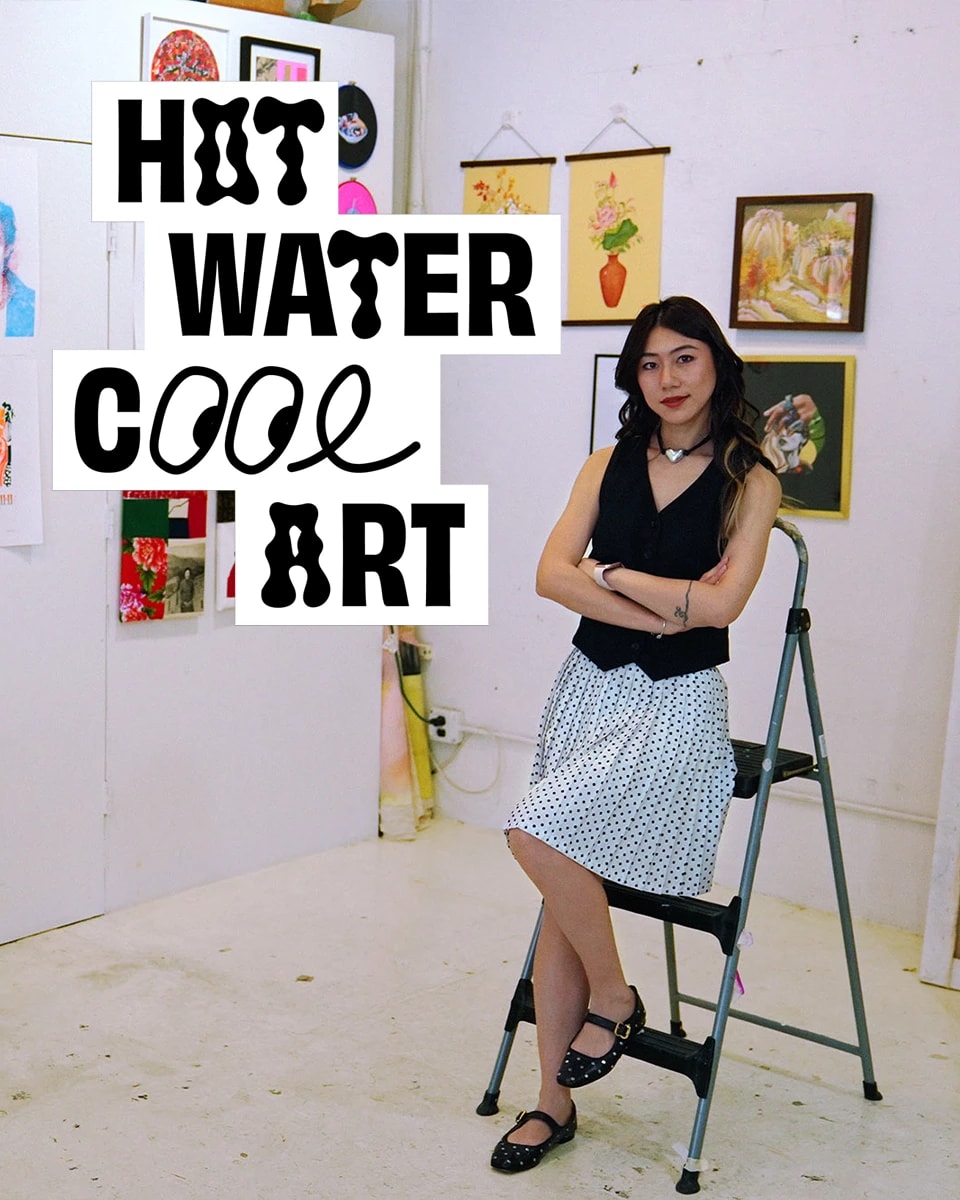 A woman in a black top and a black and white polka-dot skirt leans against a stepladder in an art studio. The words 'Hot Water Cool Art' appear on the left-hand side of the image in a stylized font.