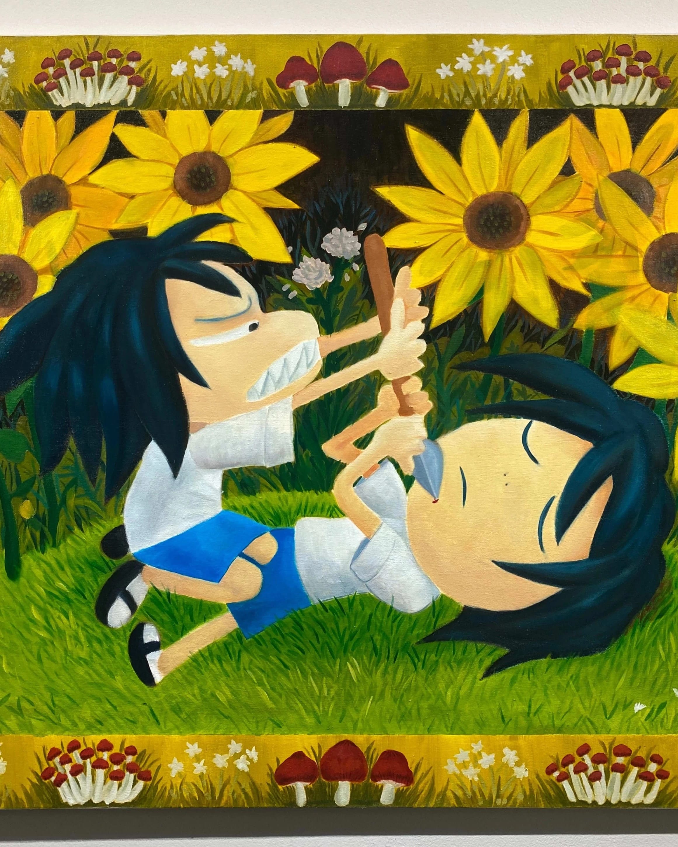 Oil painting with a yellow frame decorated with flowers and mushrooms. The painting depicts two identical little girls in a cartoonish style. One of them sits on top of the other's body with an angry face and sharp teeth, holding a spear to the other's neck, who lays on the ground in defeat. They are surrounded by large sunflowers.