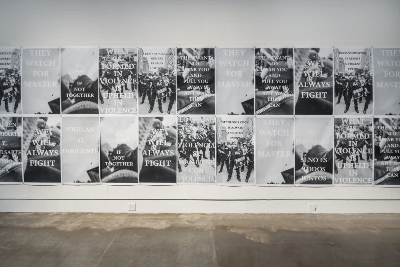 A wall of black and white posters