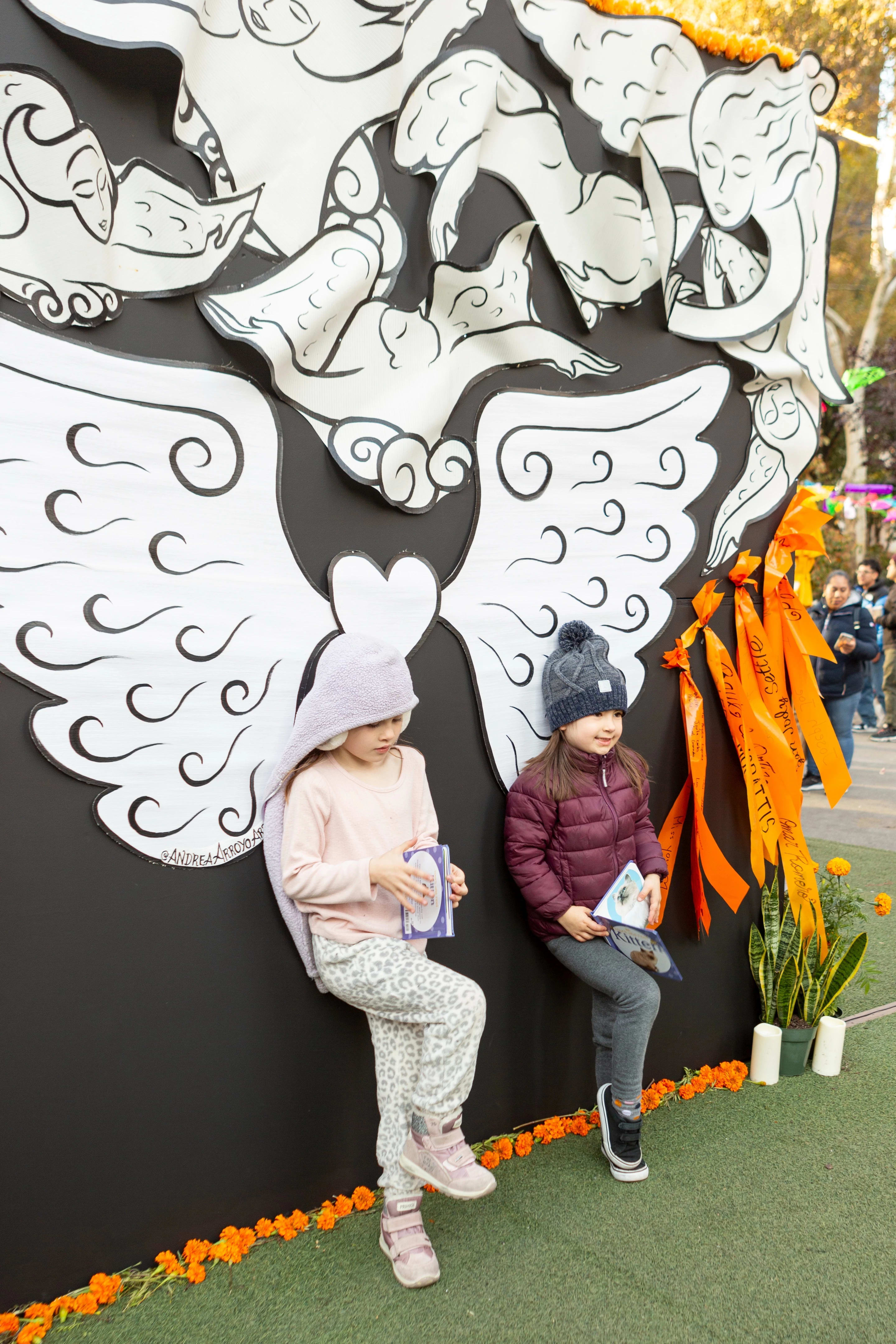 Children posing with the contemporary piece for a photo op.