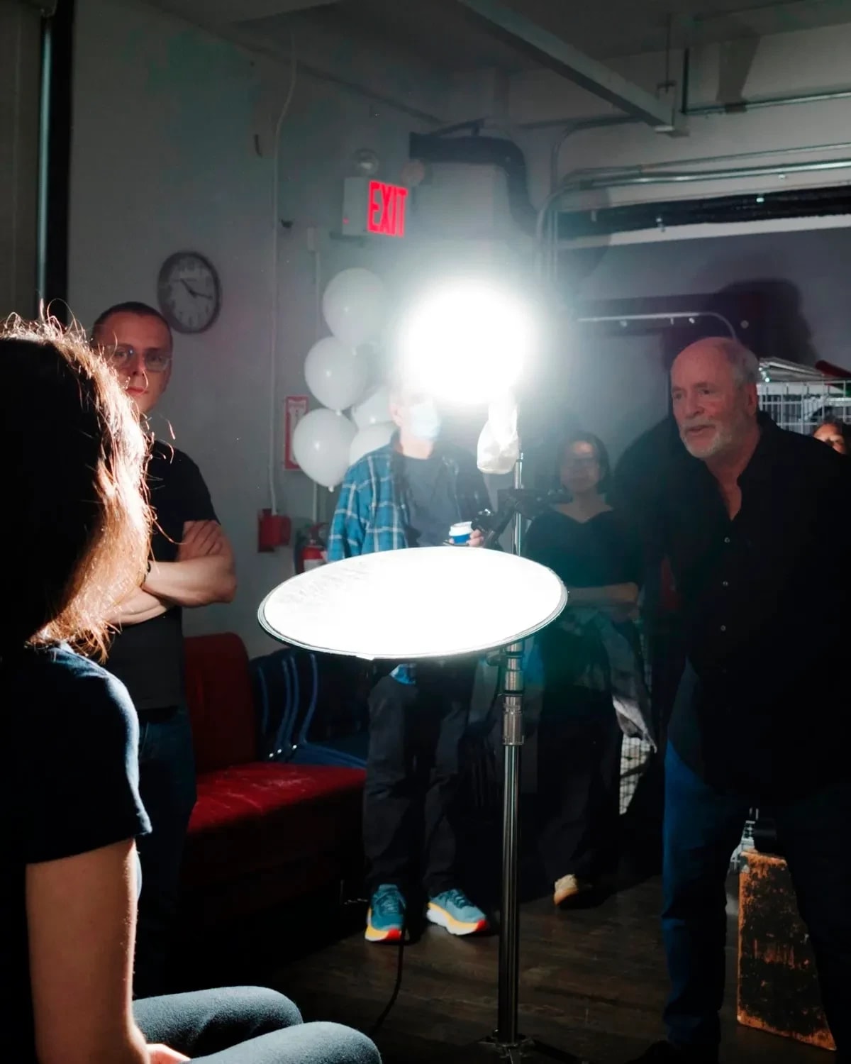 A photo from a lighting workshop with Greg Gorman, where one of our student is modeling for the class to demonstrate lighting techniques.
