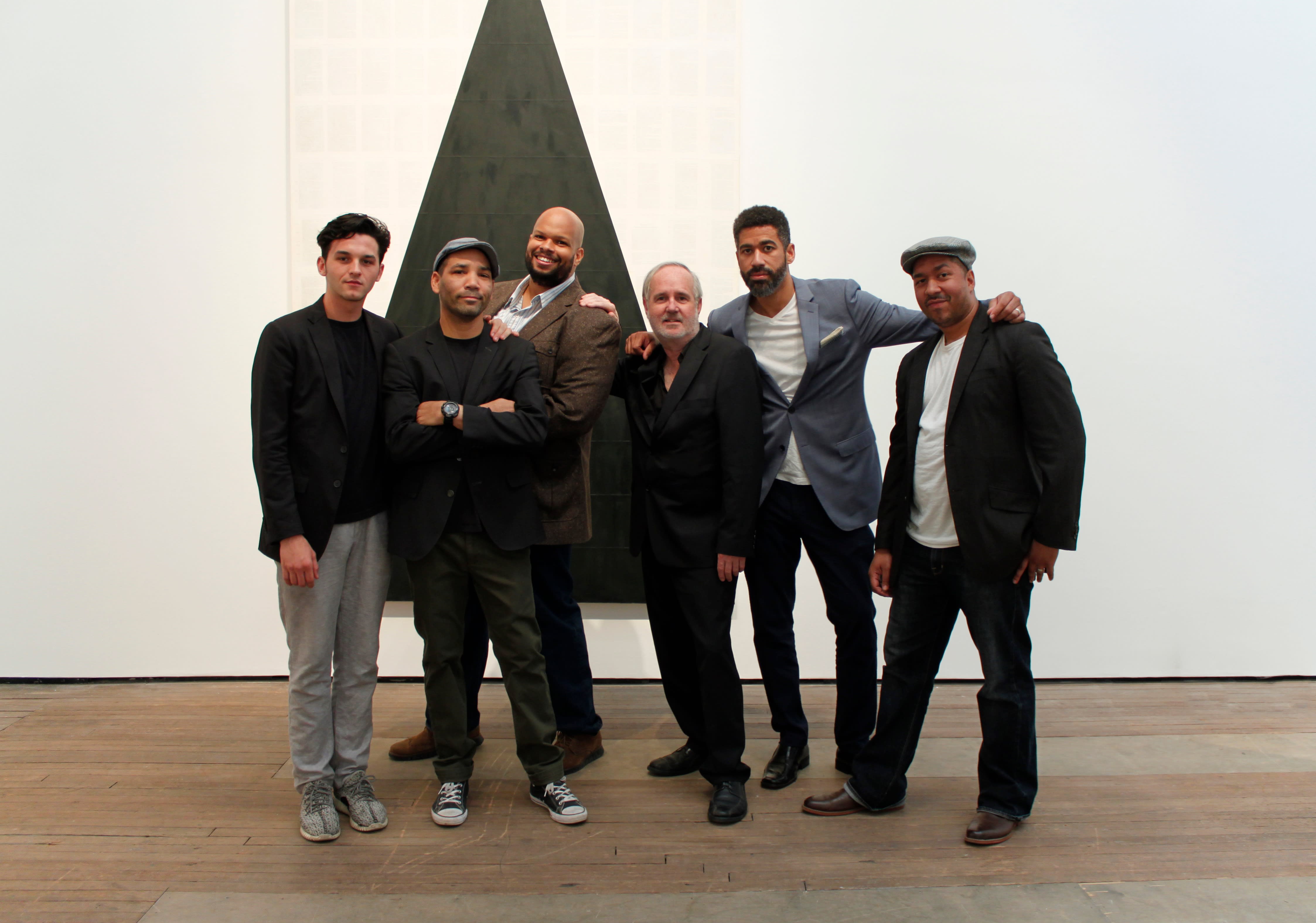 A group photo of Tim Rollins and the Studio K.O.S. members. Robert Branch is third from the left.